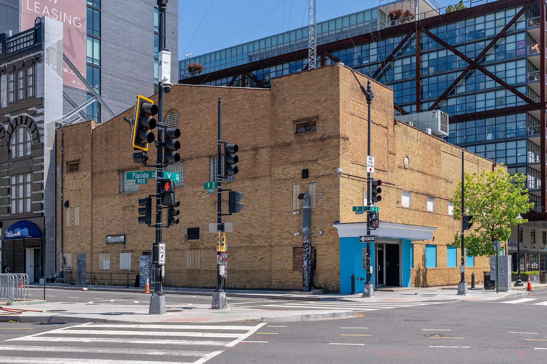 Plain brick exterior and blue entrance of the 9:30 Club at V and 9th Streets in Washington, DC.