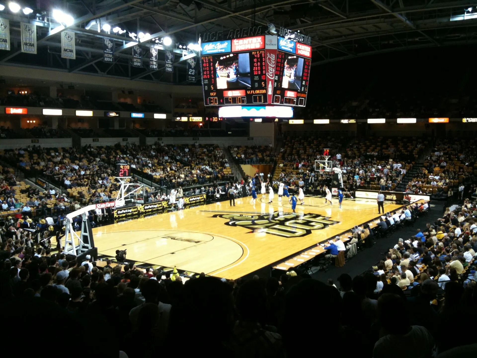 Basketball court, scoreboard, and seating bowl inside Addition Financial Arena.