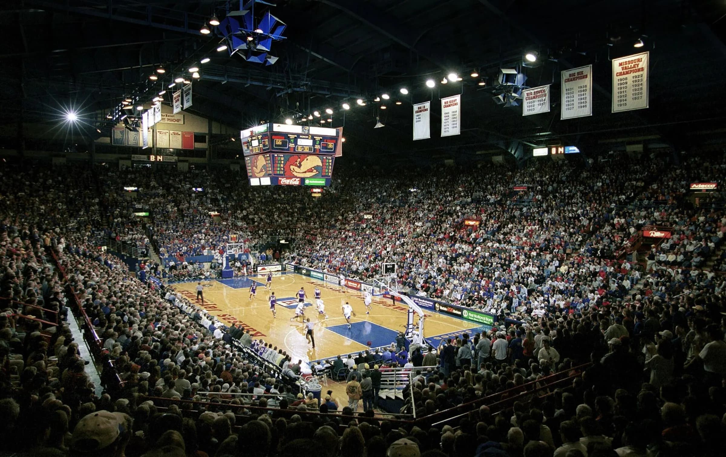 Packed Allen Fieldhouse seating bowl and basketball court during a game.