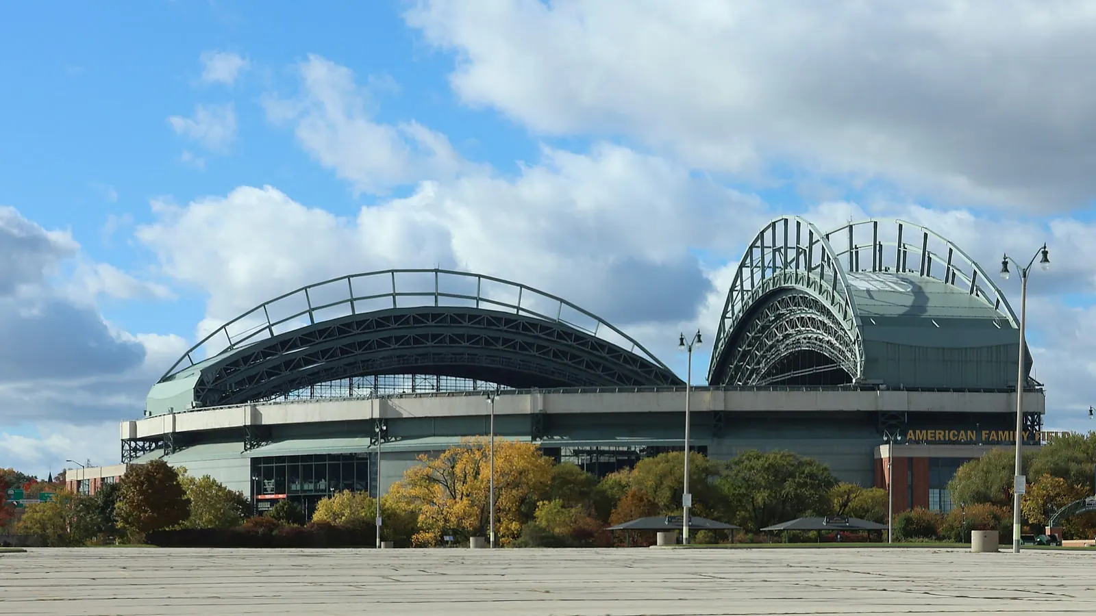 Wide daytime exterior view of American Family Field and its retractable roof in Milwaukee.