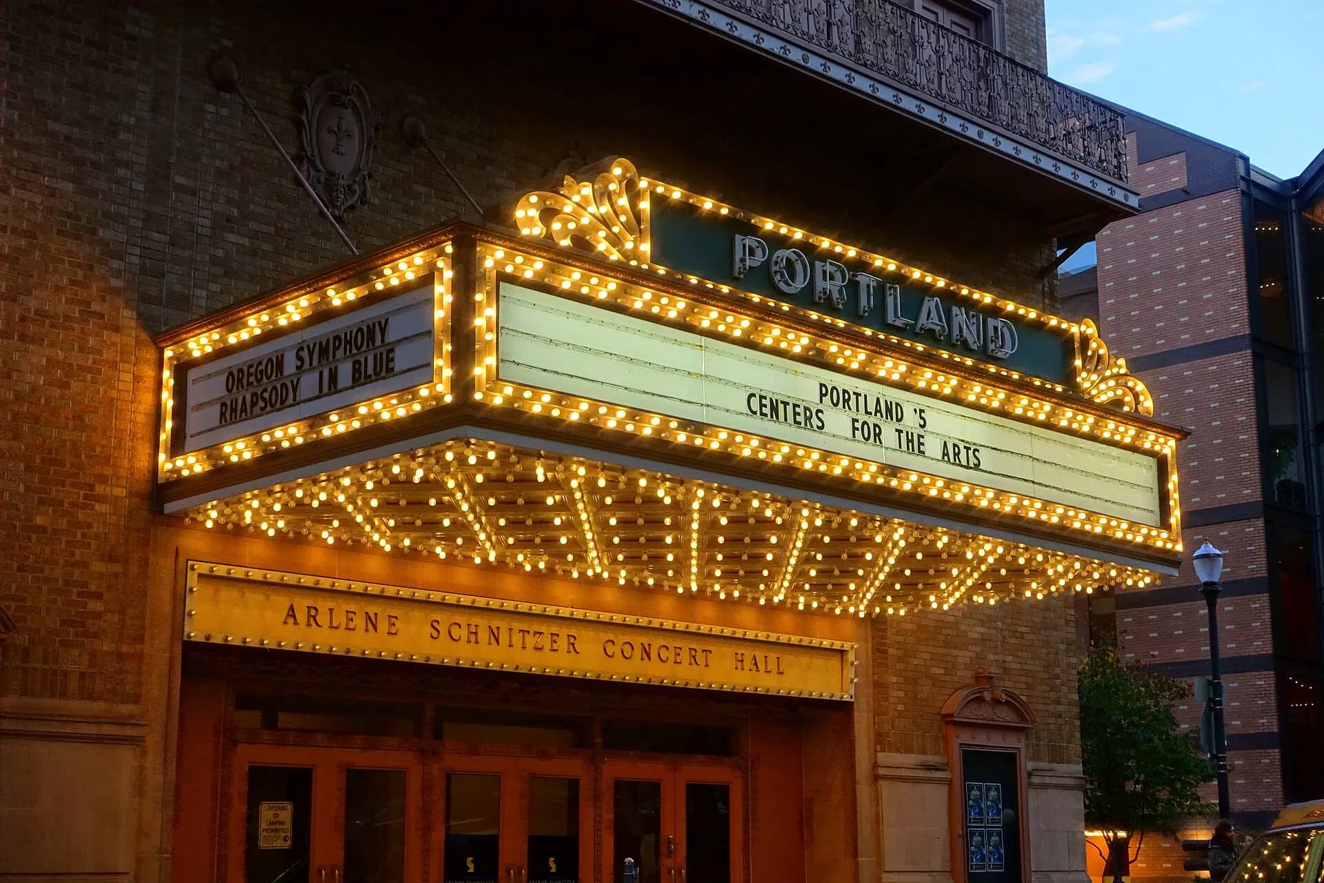 The Arlene Schnitzer Concert Hall facade and Portland marquee in daylight.