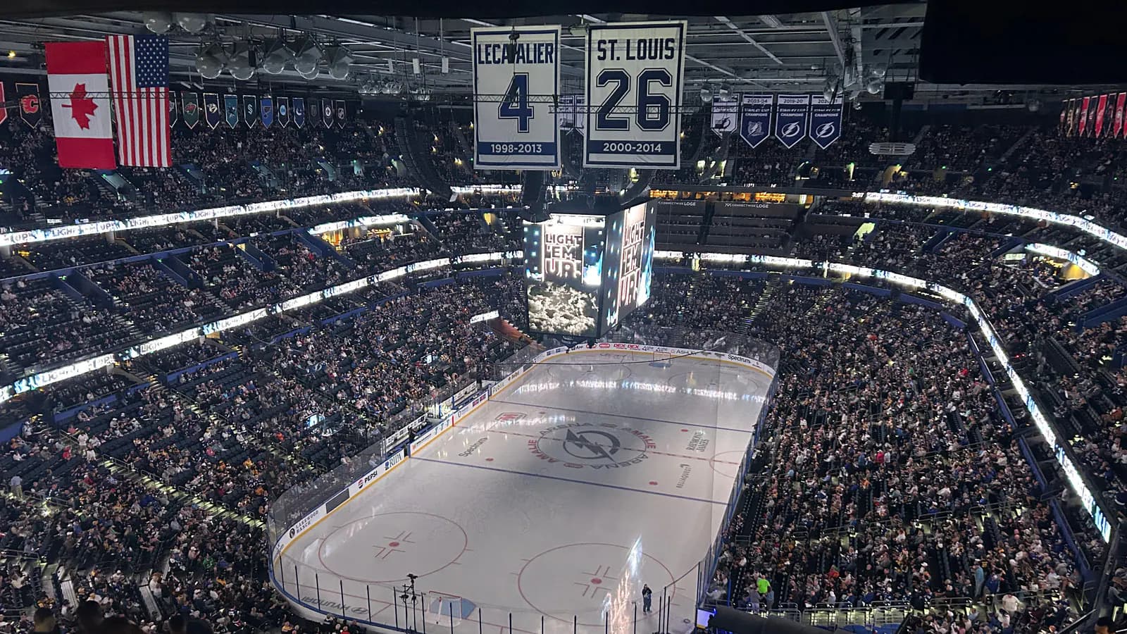 Wide interior view of Benchmark International Arena's hockey rink and seating bowl before a Tampa Bay Lightning game.