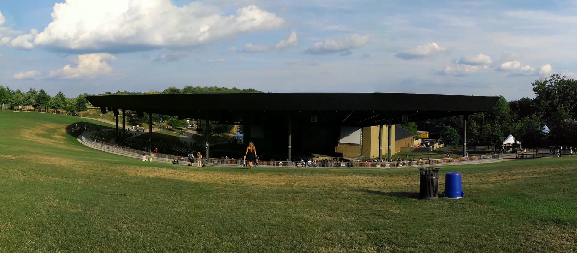 Panoramic view of the lawn, seating area, and covered stage at Bethel Woods Center for the Arts.