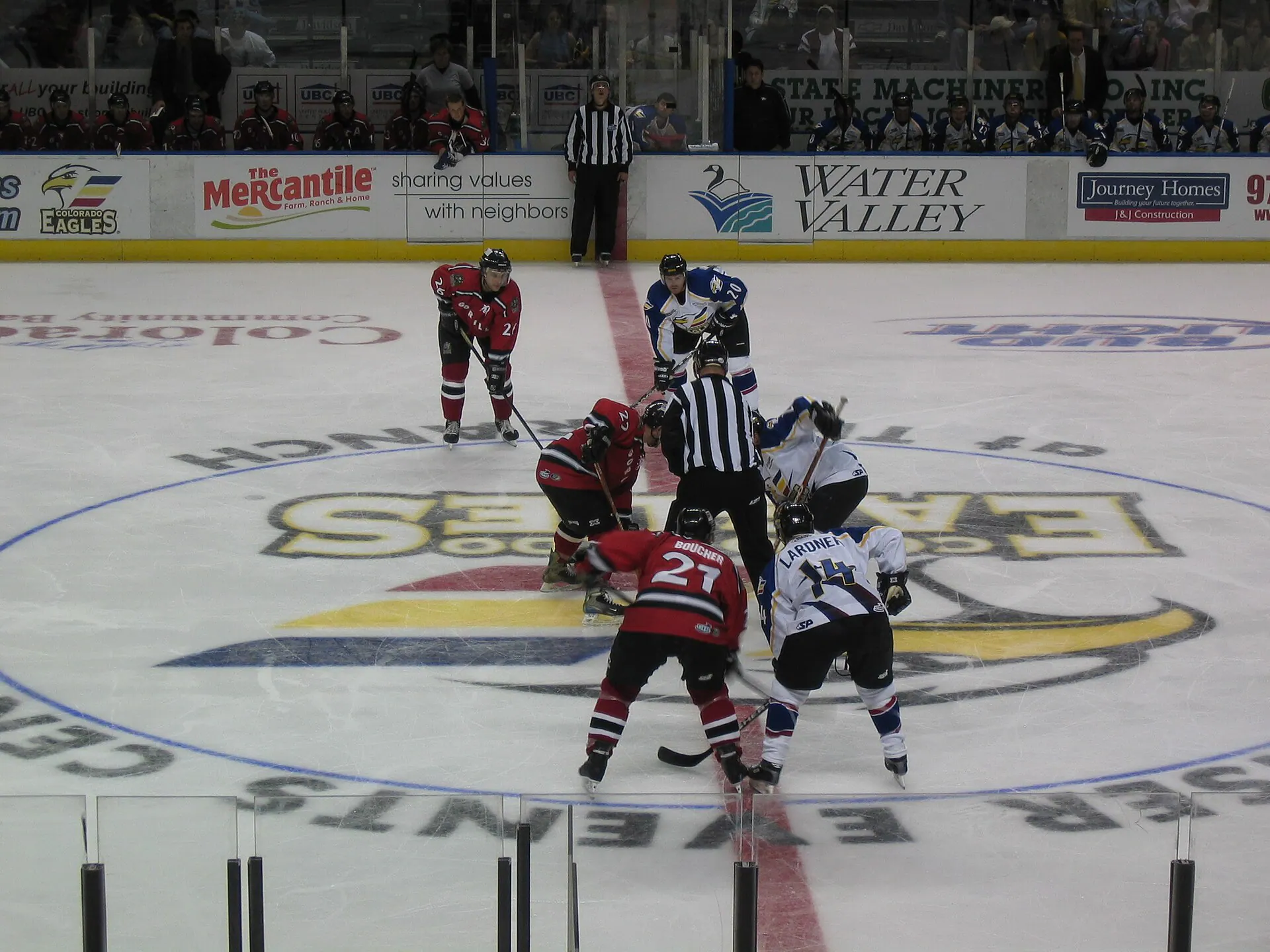 Interior view of the ice and seating bowl at Blue Arena during a hockey exhibition.