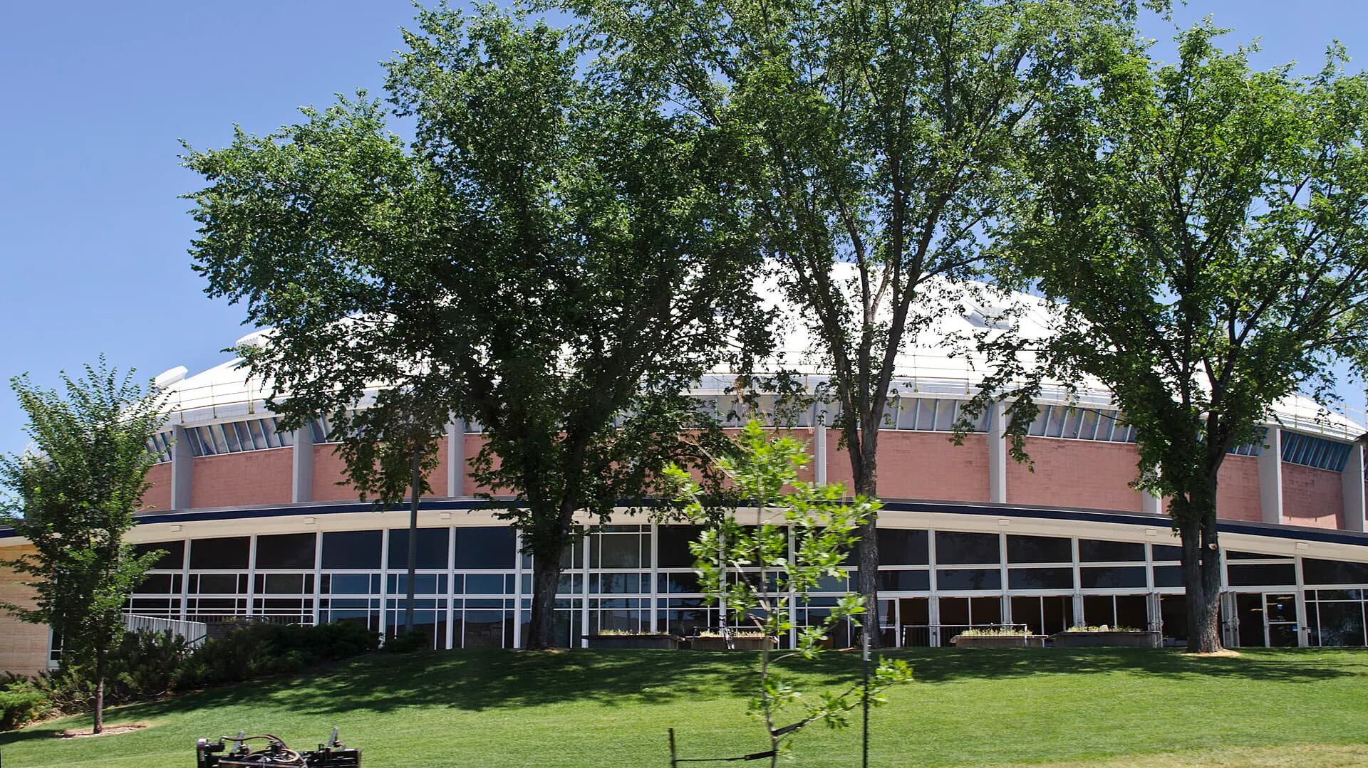 Wide exterior view of Brick Breeden Fieldhouse at Montana State University.