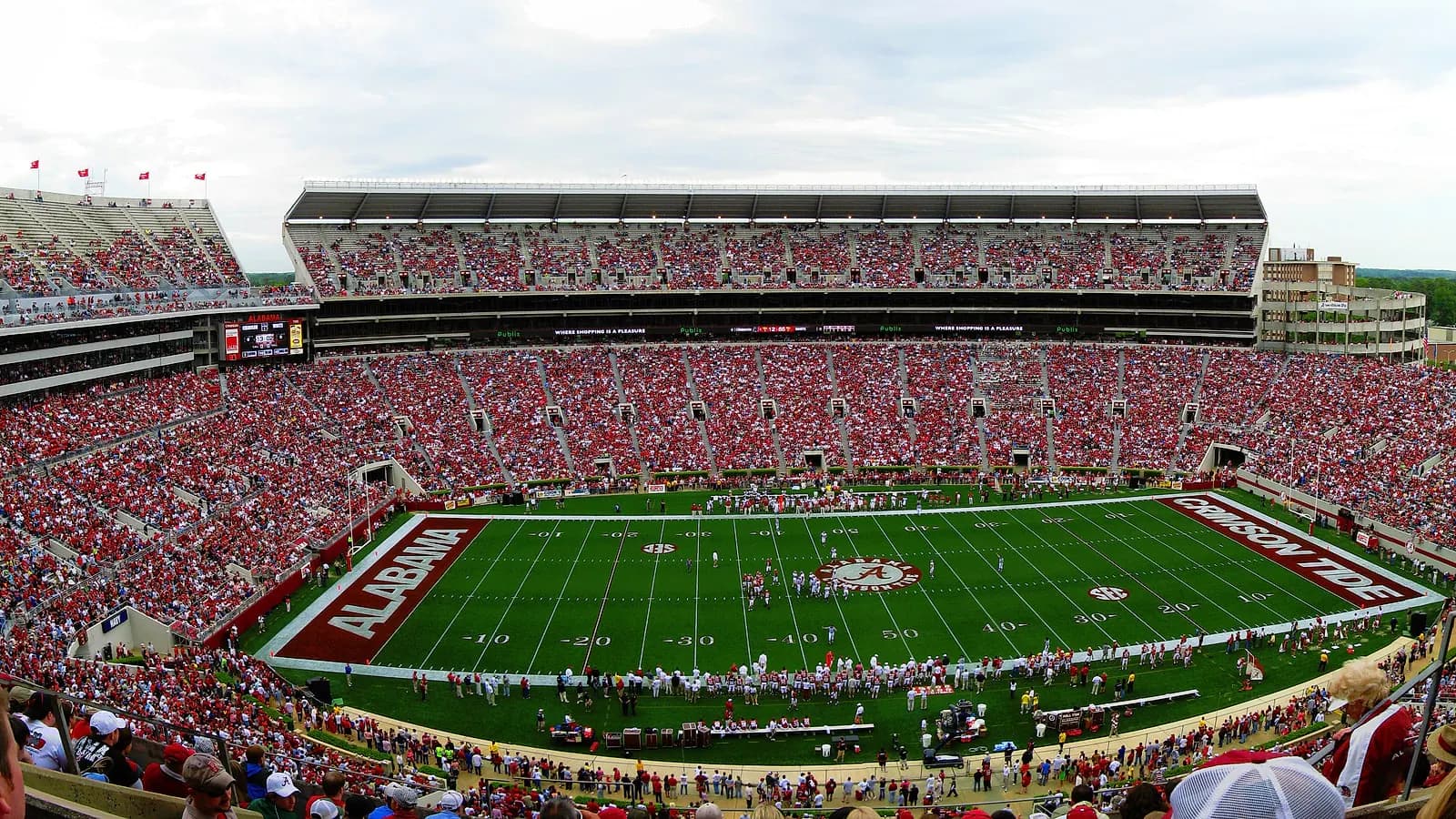 Wide game-day panorama of Bryant-Denny Stadium's field and packed seating bowl.