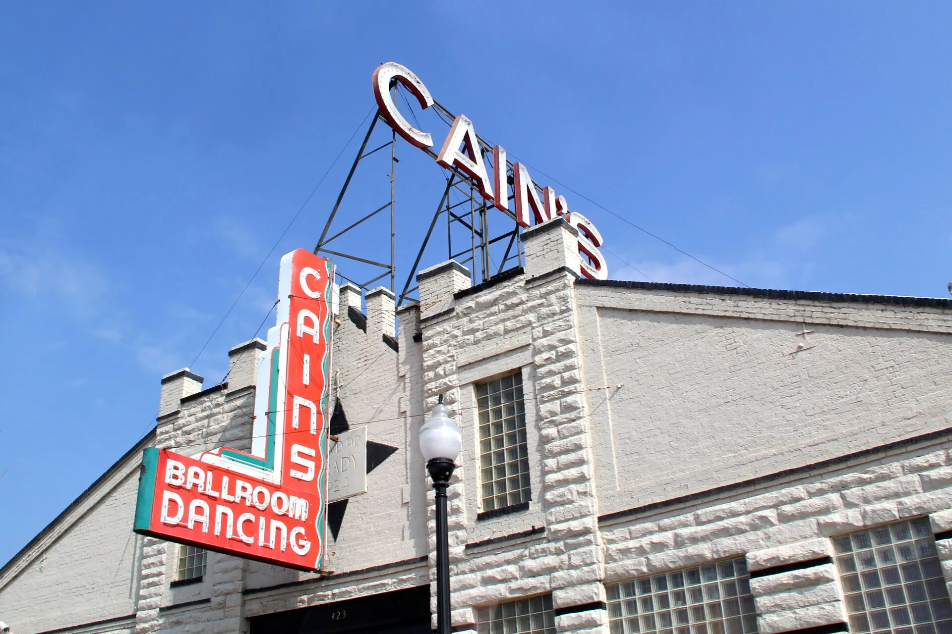 Cain's Ballroom's signed brick facade and entrance in Tulsa.