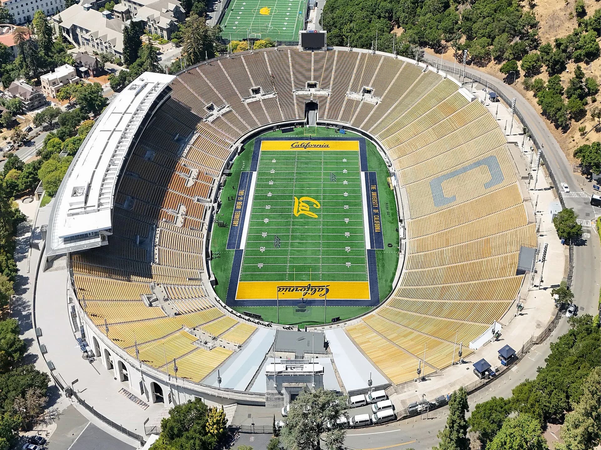 Aerial view of California Memorial Stadium set into the Berkeley Hills.