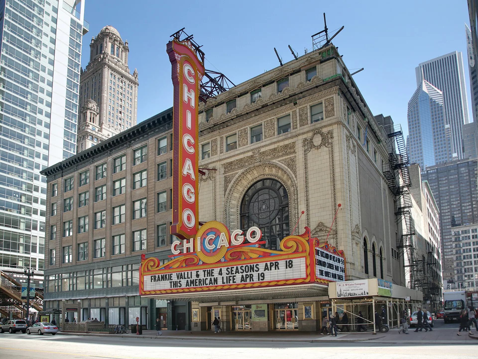 The Chicago Theatre marquee and State Street exterior in daylight.