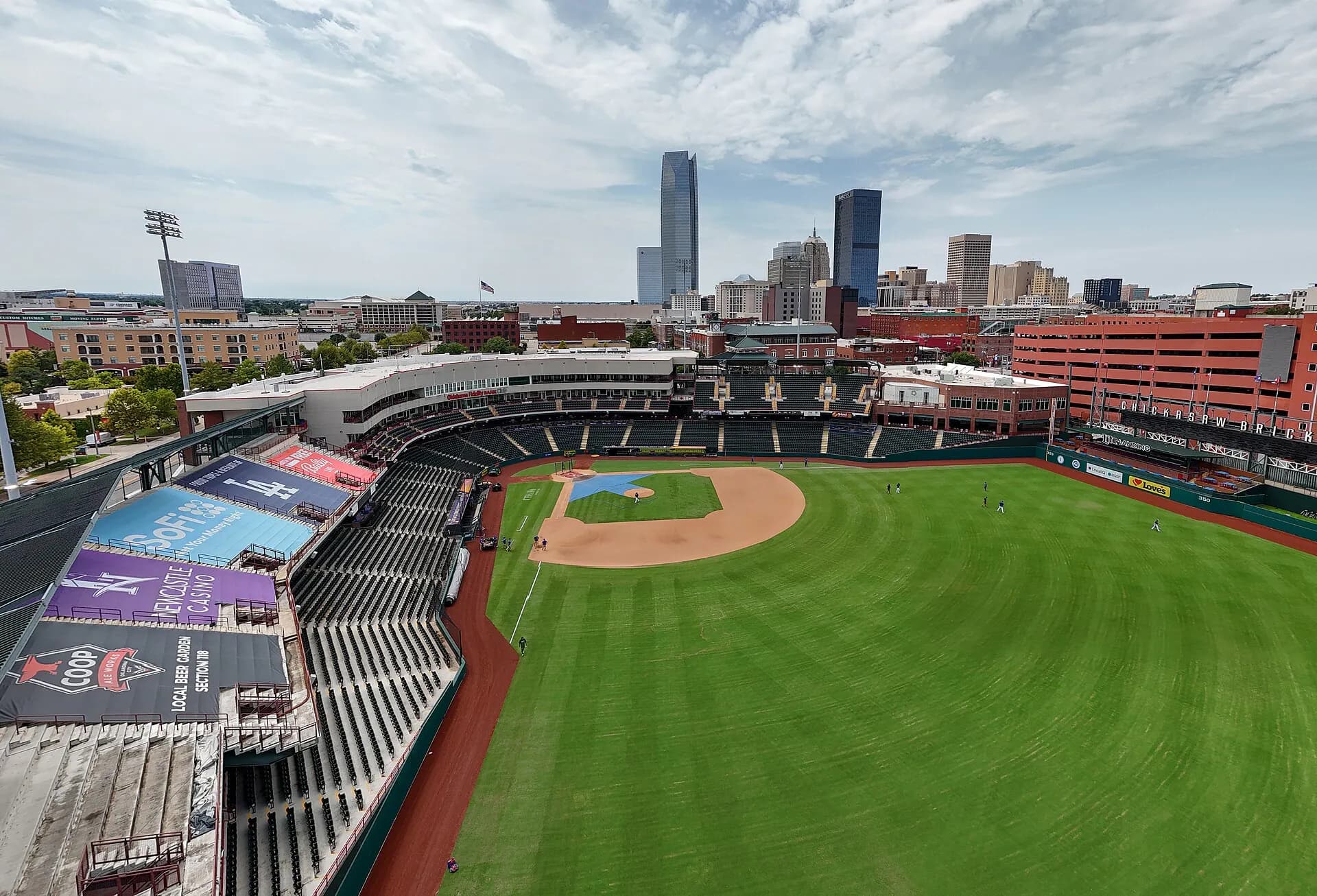 Wide interior view of Chickasaw Bricktown Ballpark and the Oklahoma City skyline.