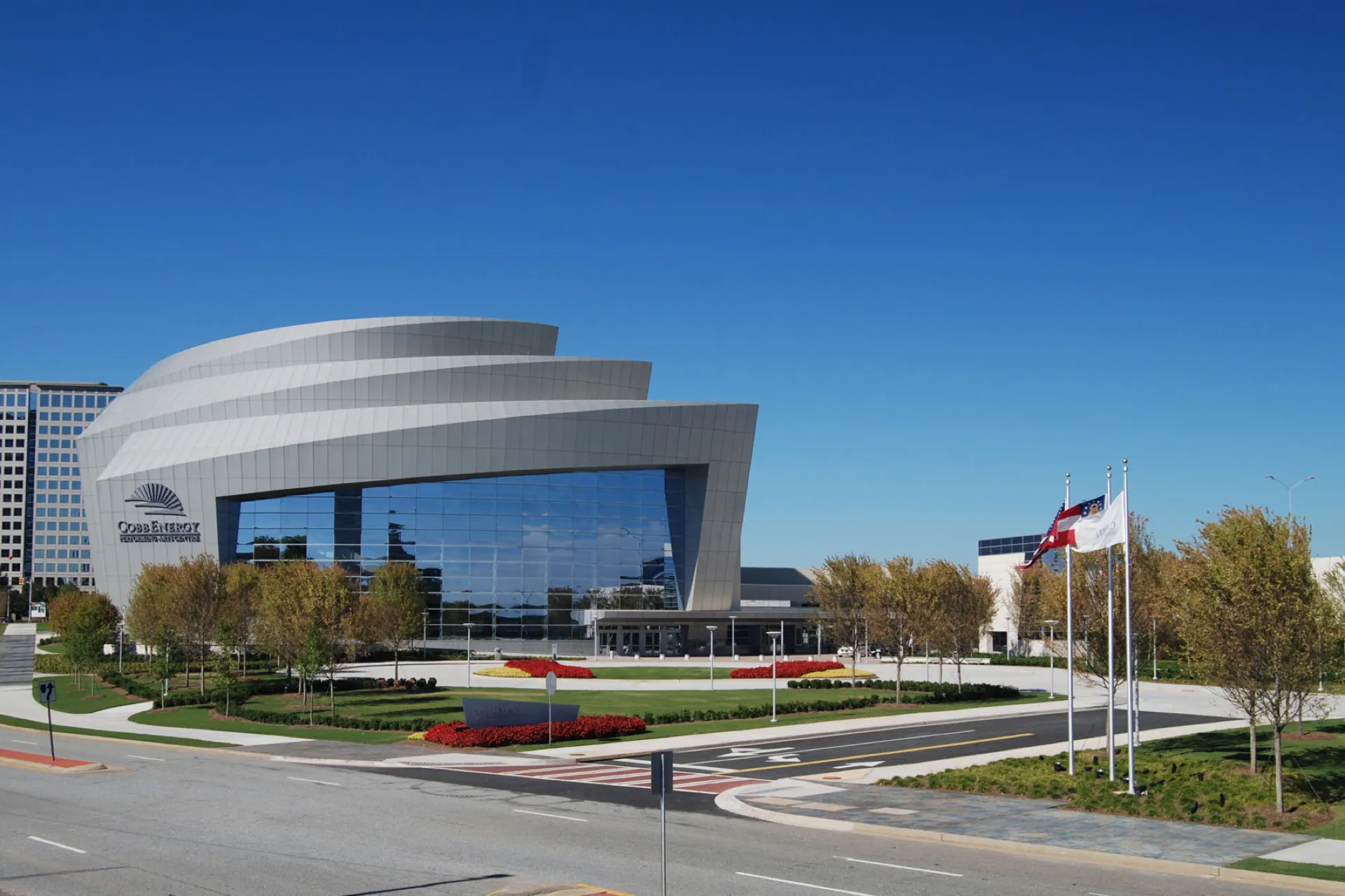 Wide exterior view of the Cobb Energy Performing Arts Centre and entrance plaza.