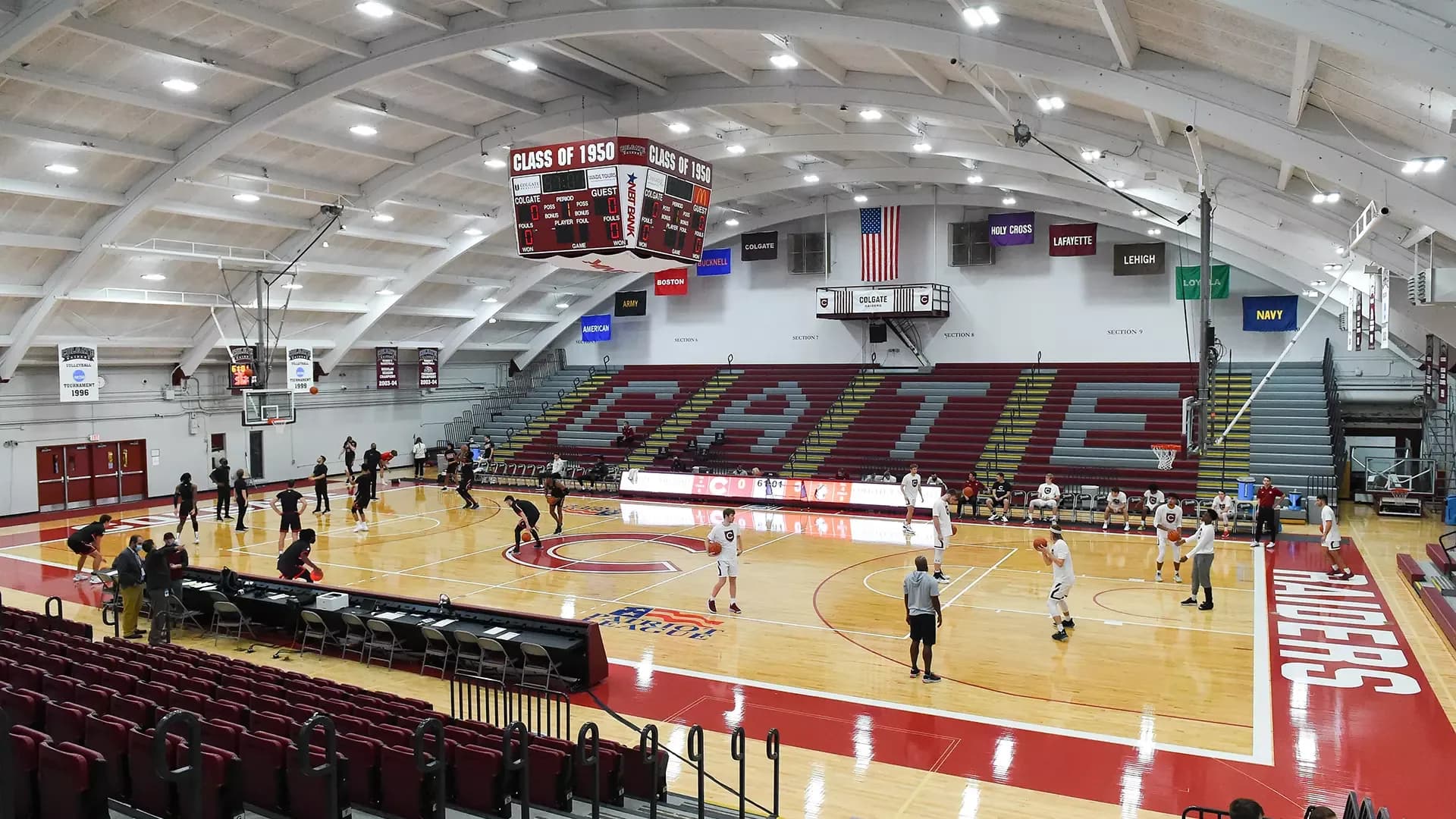 Cotterell Court in Colgate Athletics’ January 2022-source facility collection. This wide practice-floor photograph shows the wood floor, chairbacks and open red bleachers. The facility identifies east-side chairbacks and west-side general-admission bleachers; the photograph does not identify an exact ticketed section and row.