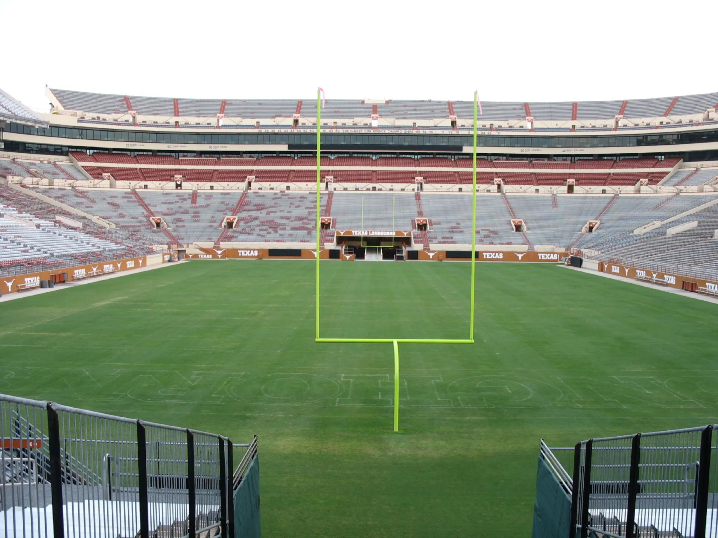 Empty field and north end-zone seating viewed from inside the stadium.