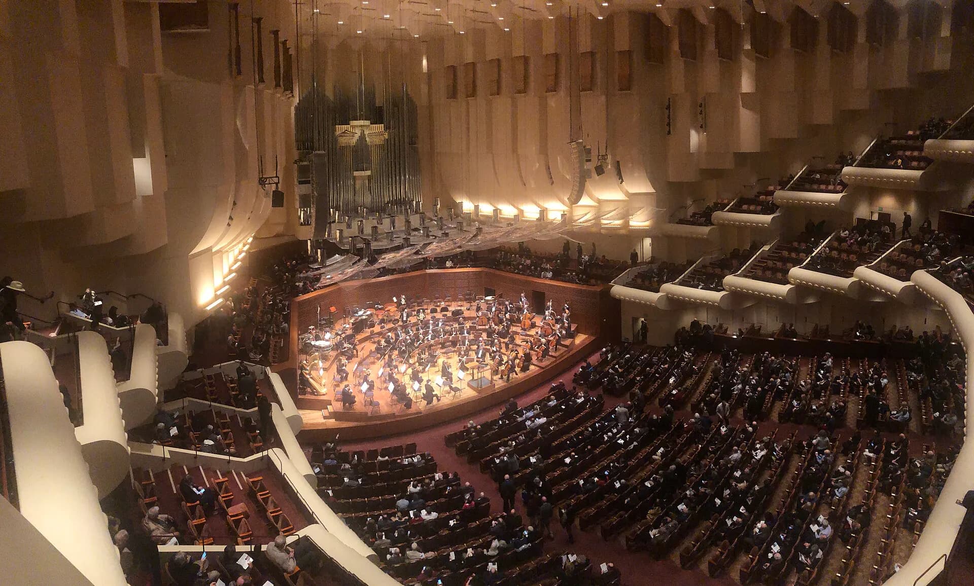 Davies Symphony Hall's stage, organ, and terraced audience seating viewed from across the concert hall.