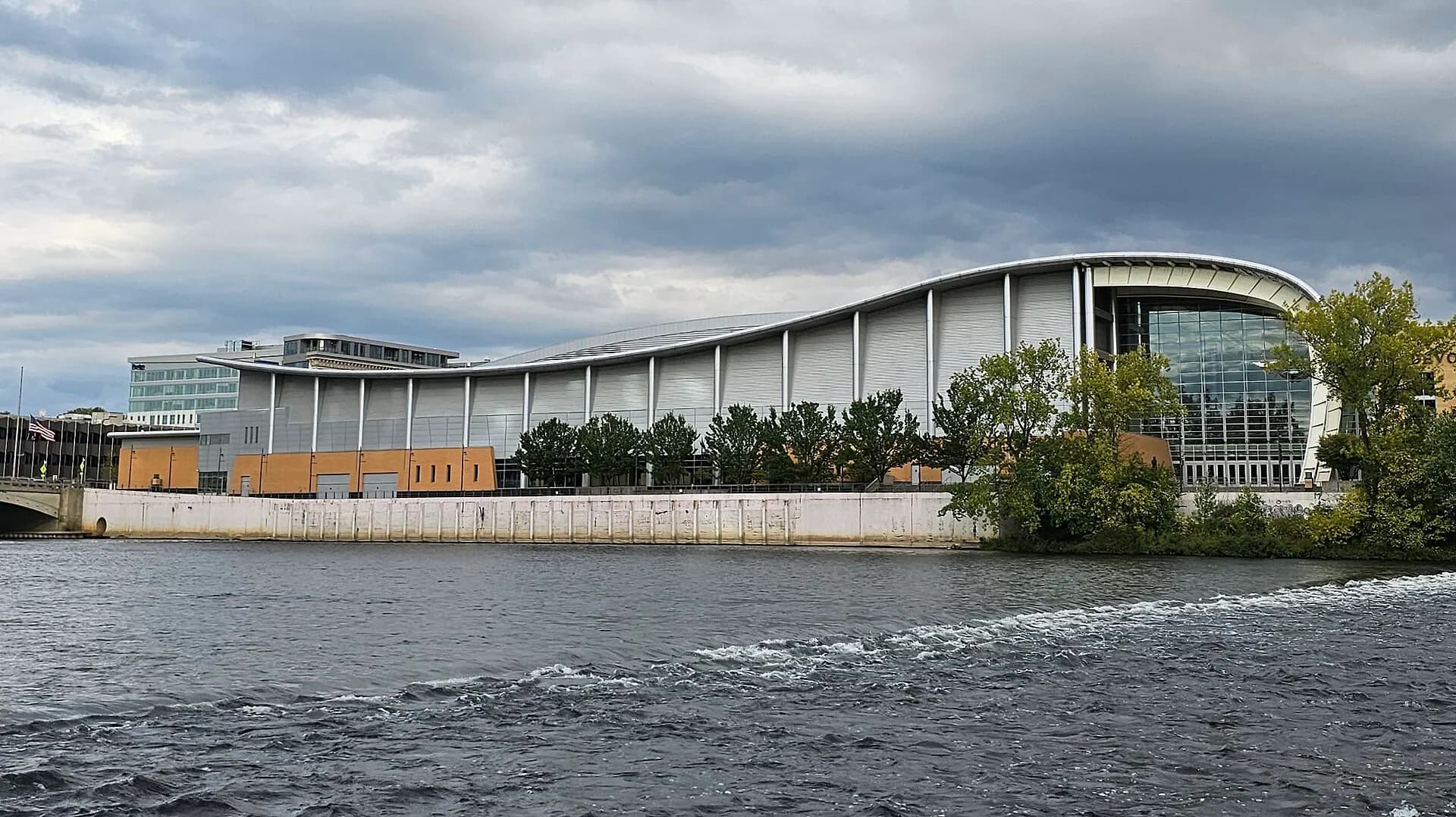 Wide exterior view of DeVos Performance Hall along the Grand River.