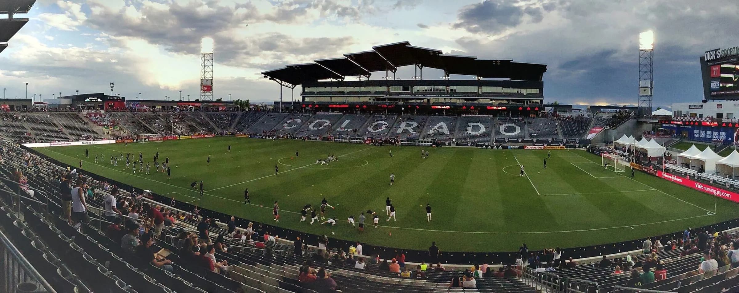 Wide-angle match view across Dick's Sporting Goods Park's pitch and seating bowl.