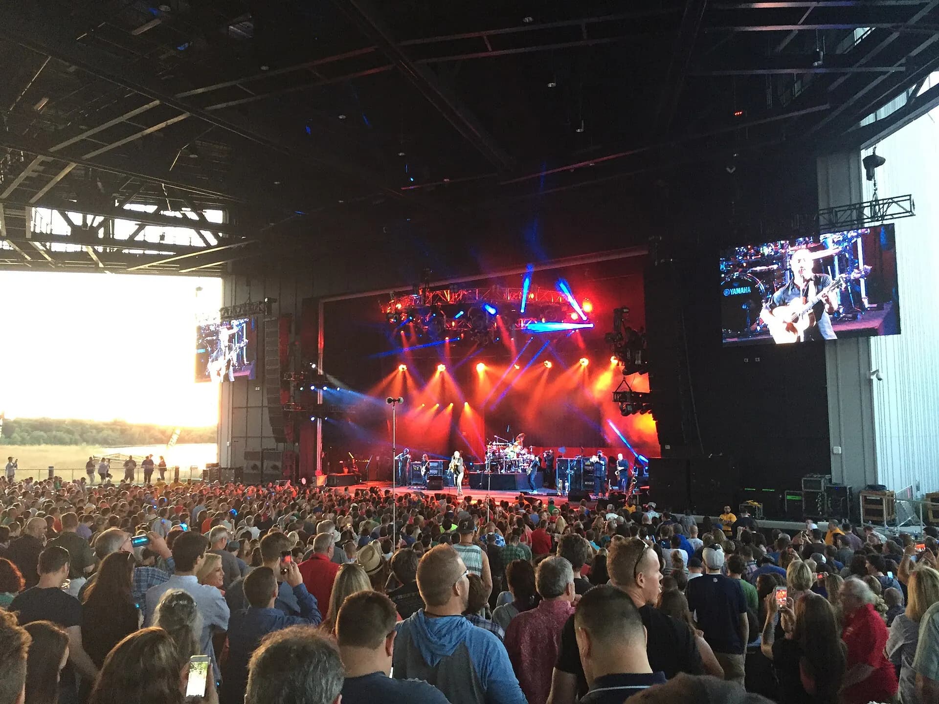 Concert crowd facing the covered stage at Empower Federal Credit Union Amphitheater at Lakeview.