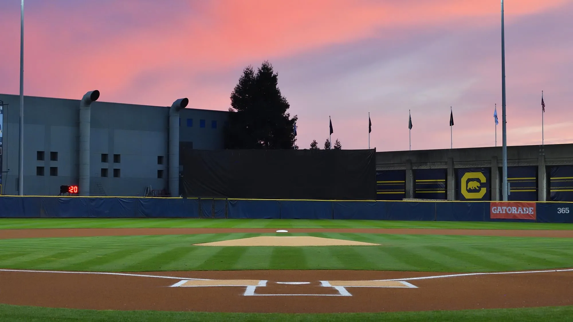 Evans Diamond at Stu Gordon Stadium’s diamond and outfield at sunset in California Athletics’ facility collection. Protective netting remains visible; no individual capture date or numbered camera seat is supplied.