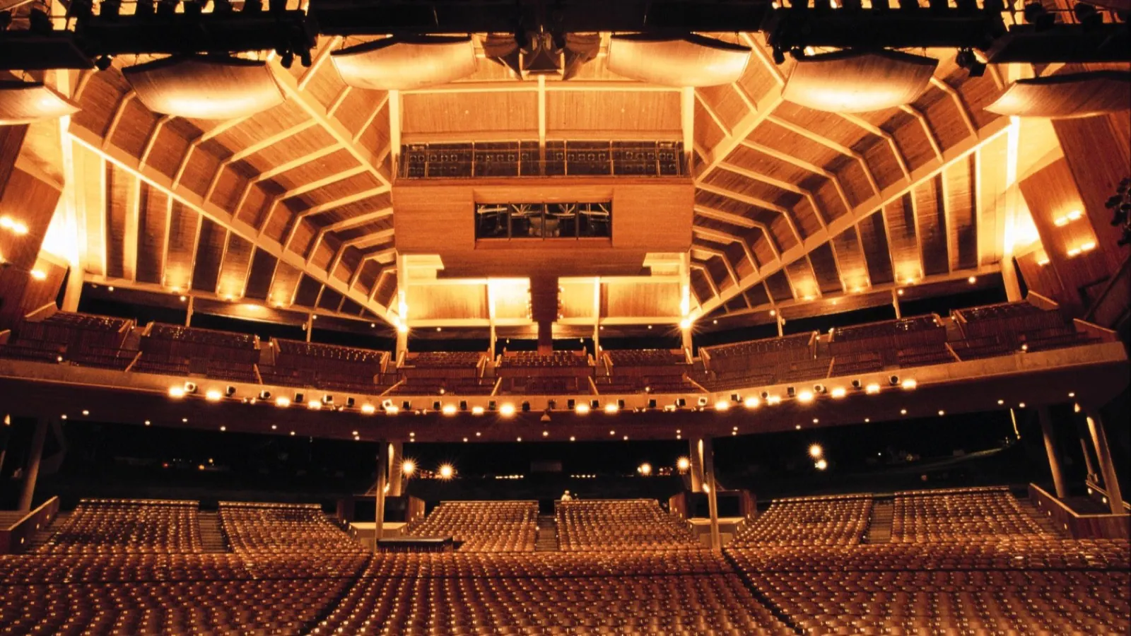 Wide interior view across the seats and stage of Wolf Trap's Filene Center.