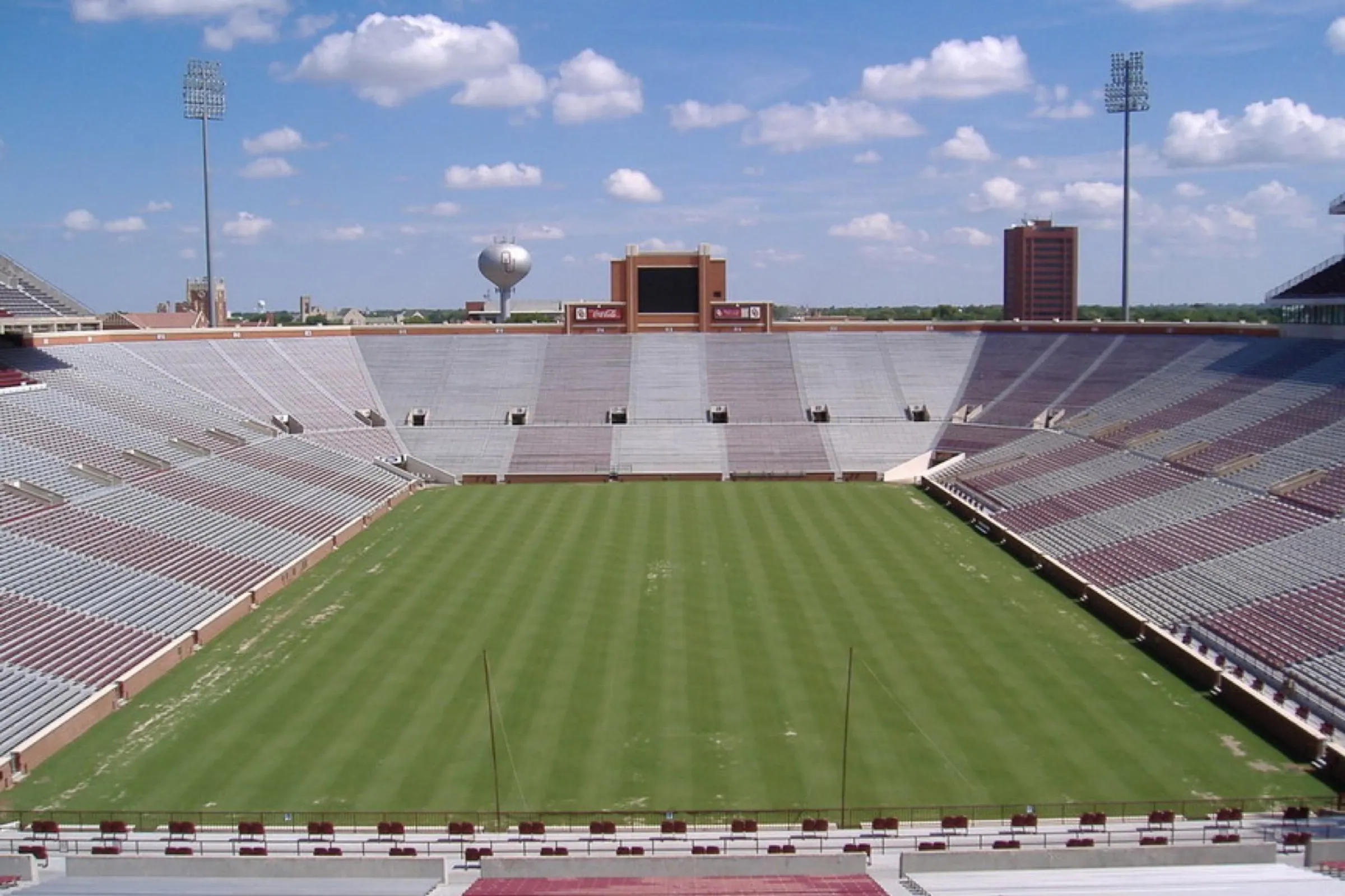 Empty Oklahoma Memorial Stadium field and seating viewed from the upper deck.