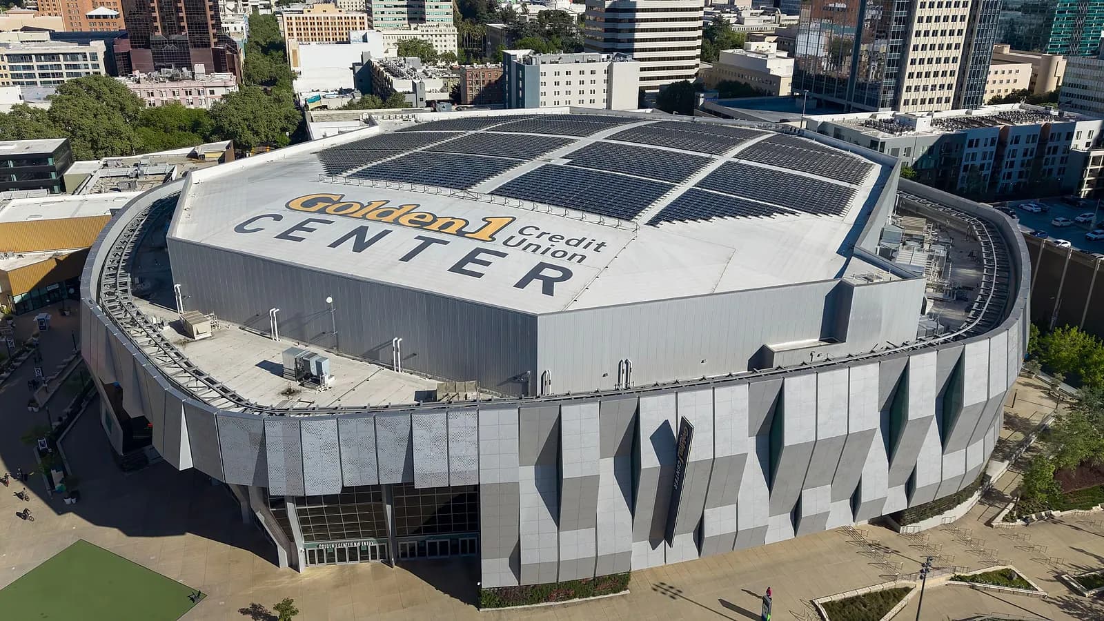 High daytime aerial view of the full Golden 1 Center exterior in downtown Sacramento.