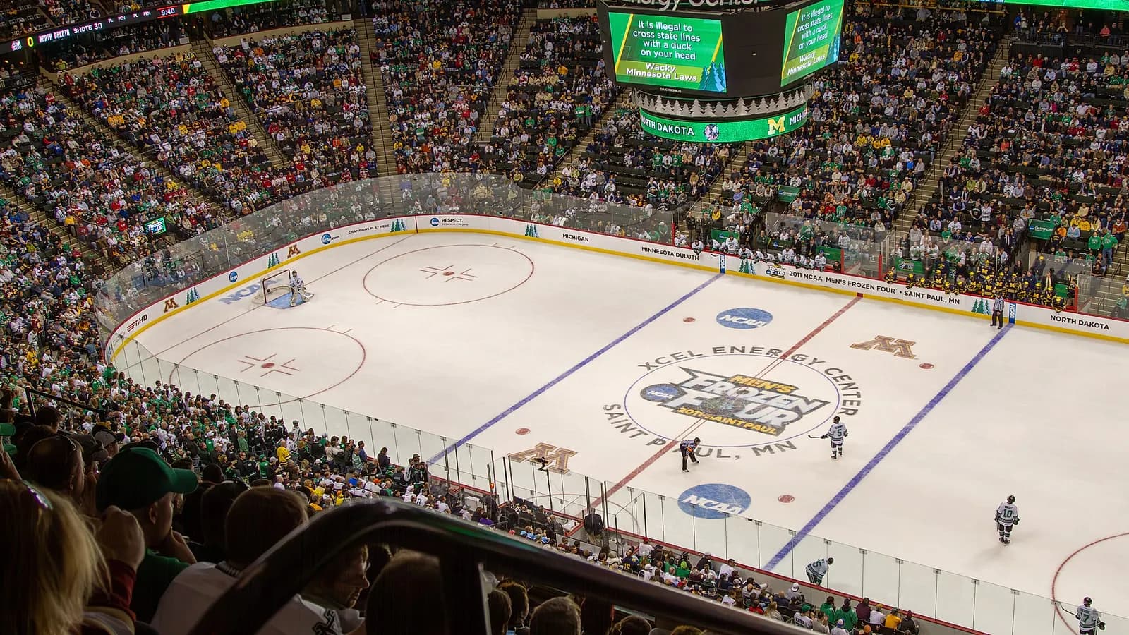 Wide interior view of the hockey bowl during an NCAA Frozen Four game at Grand Casino Arena, under its former Xcel Energy Center name.