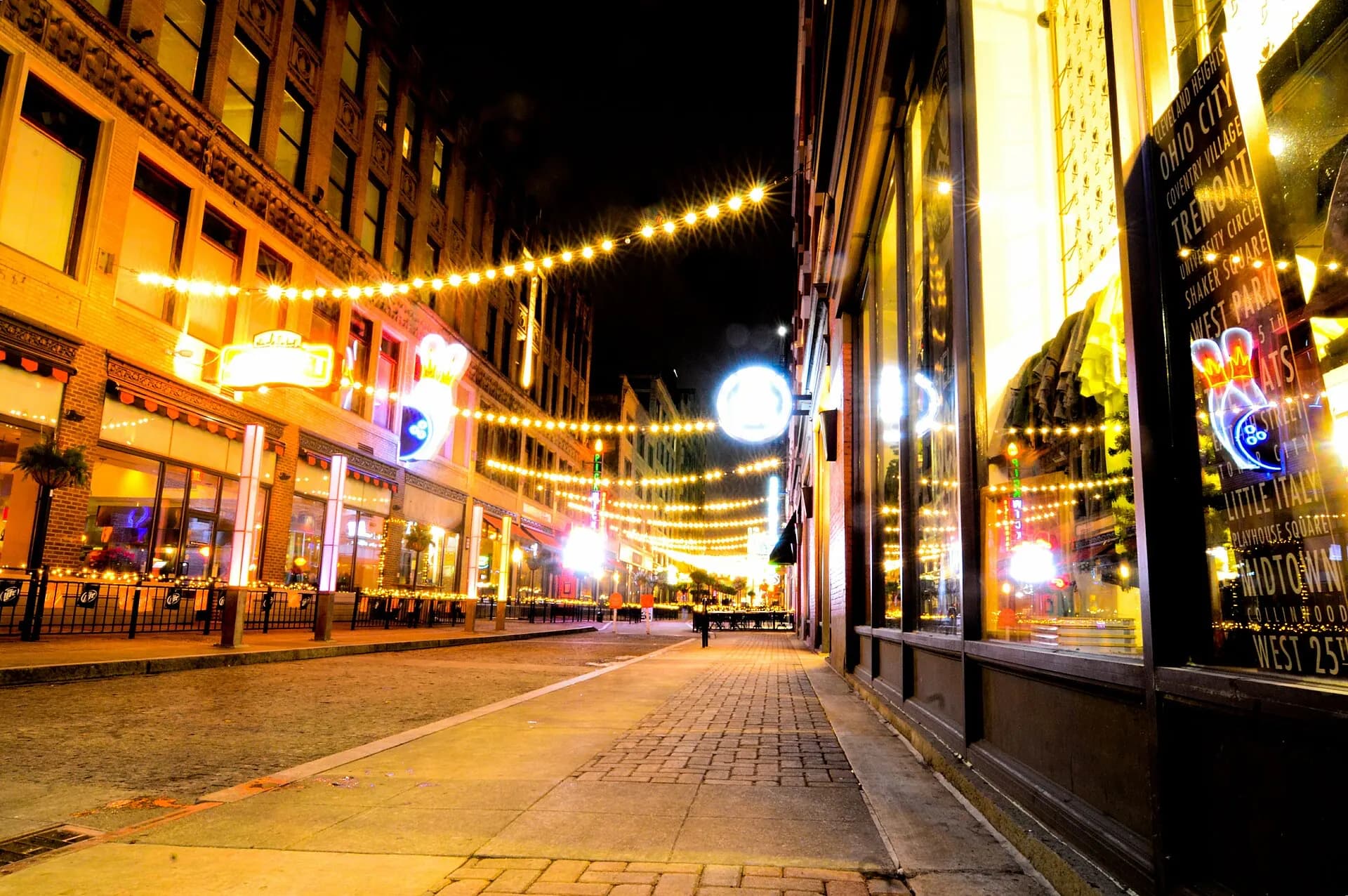 East 4th Street at night, showing the arrival corridor near Hilarities 4th Street Theatre.