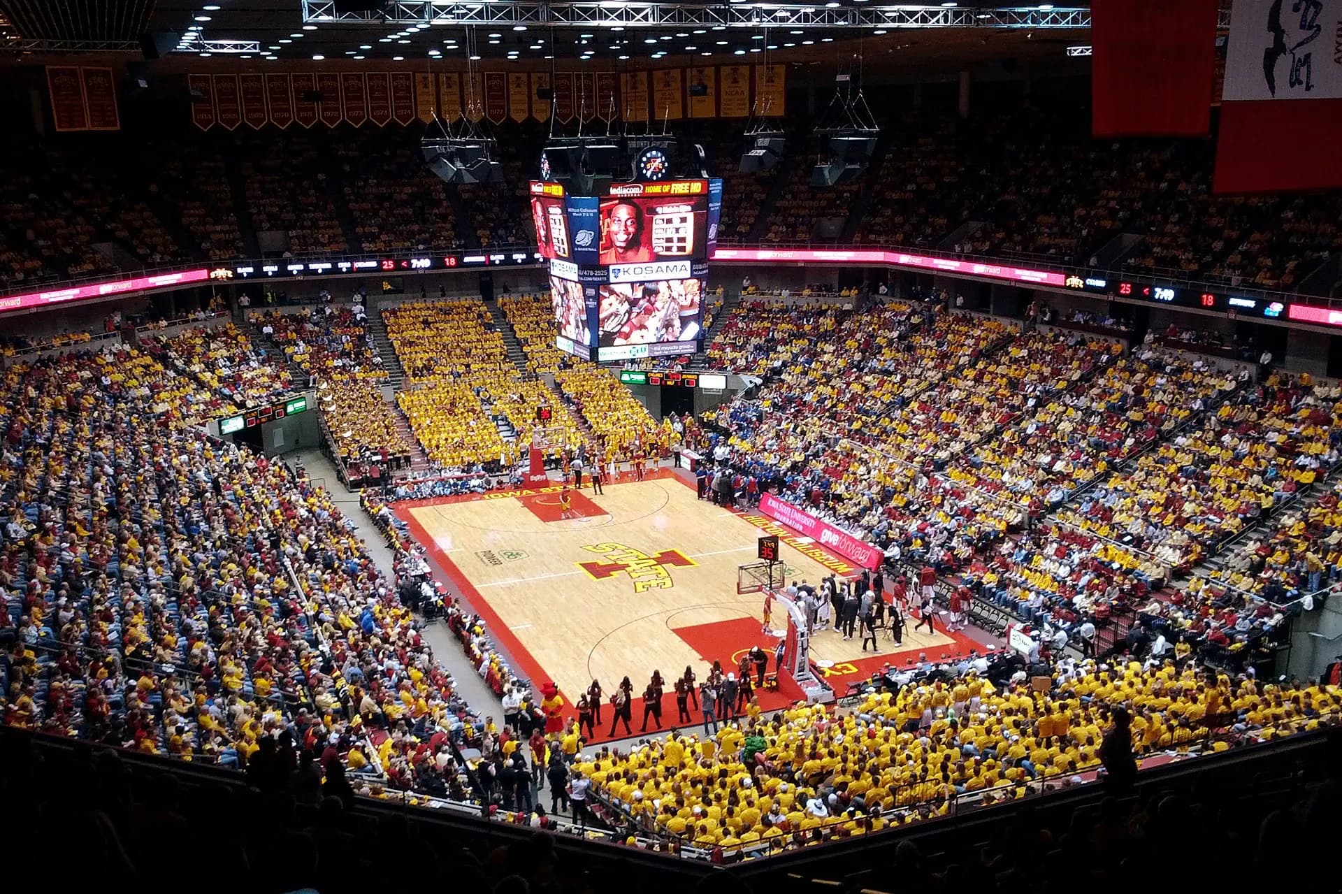 A packed basketball crowd fills the seating bowl inside Hilton Coliseum.