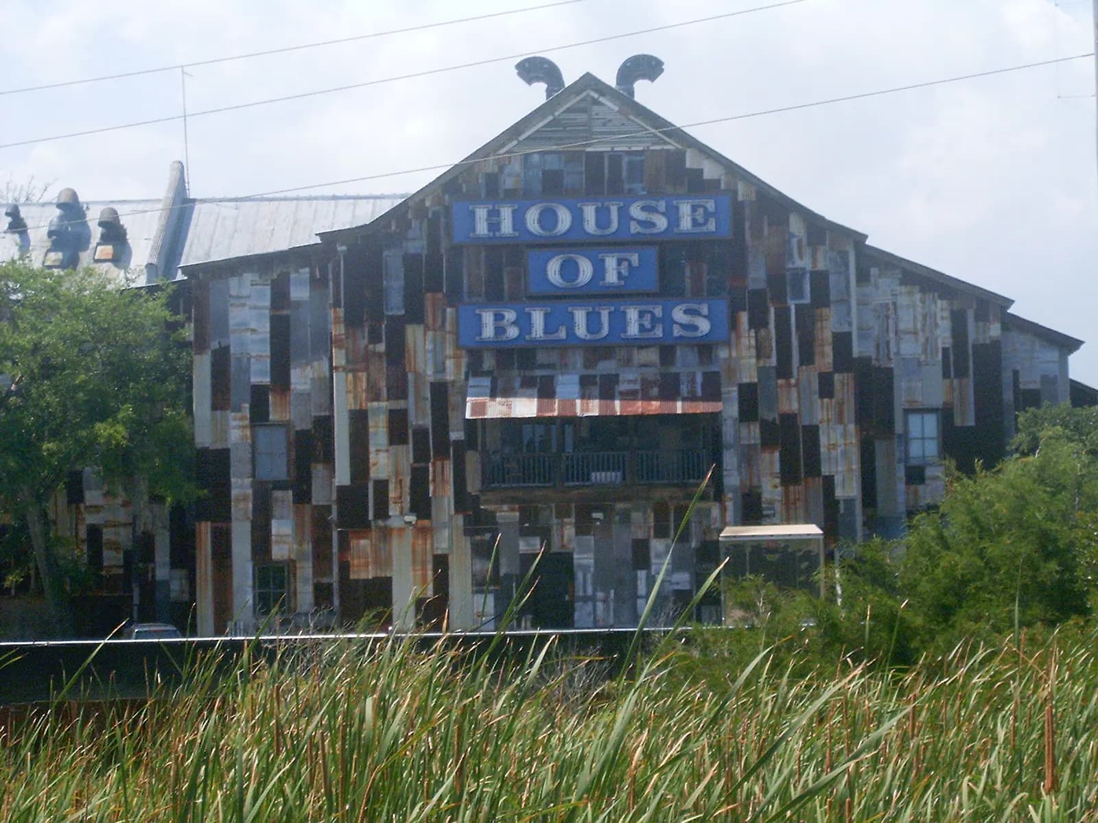 Wide exterior view of House of Blues Myrtle Beach and its distinctive entrance.