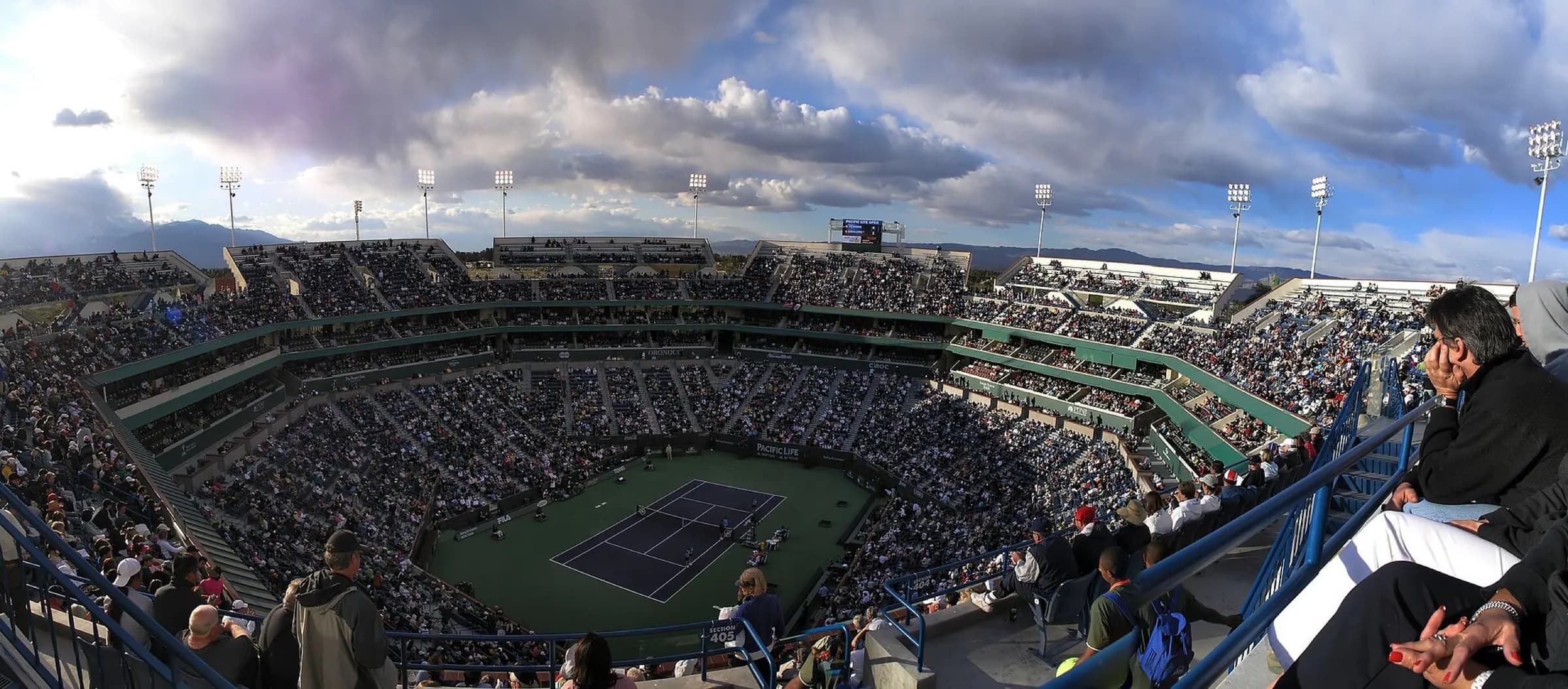 Wide upper-level view across packed Stadium 1 at the Indian Wells Tennis Garden during a match.