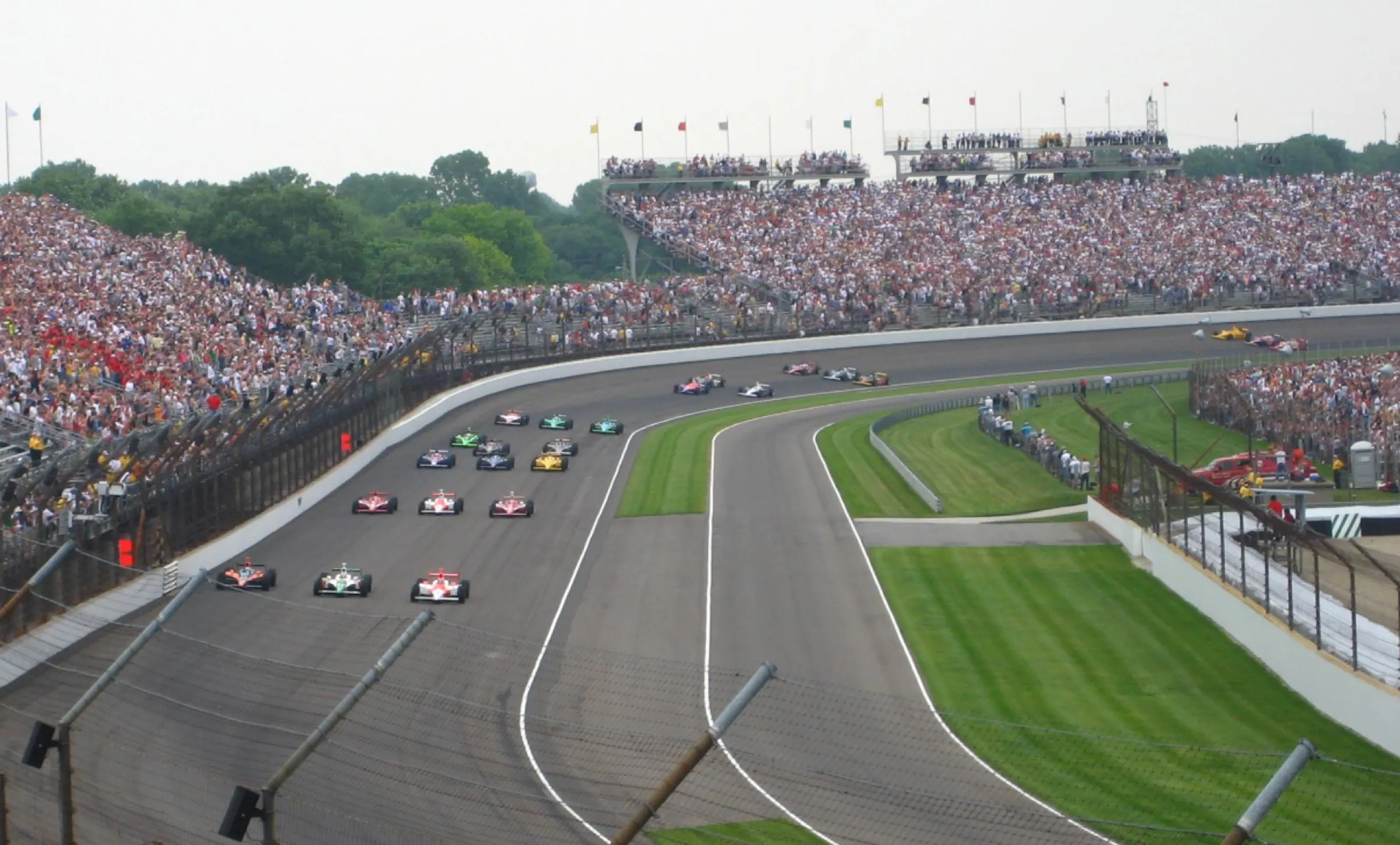 Indianapolis 500 starting grid, front straight, and packed grandstands before the race.