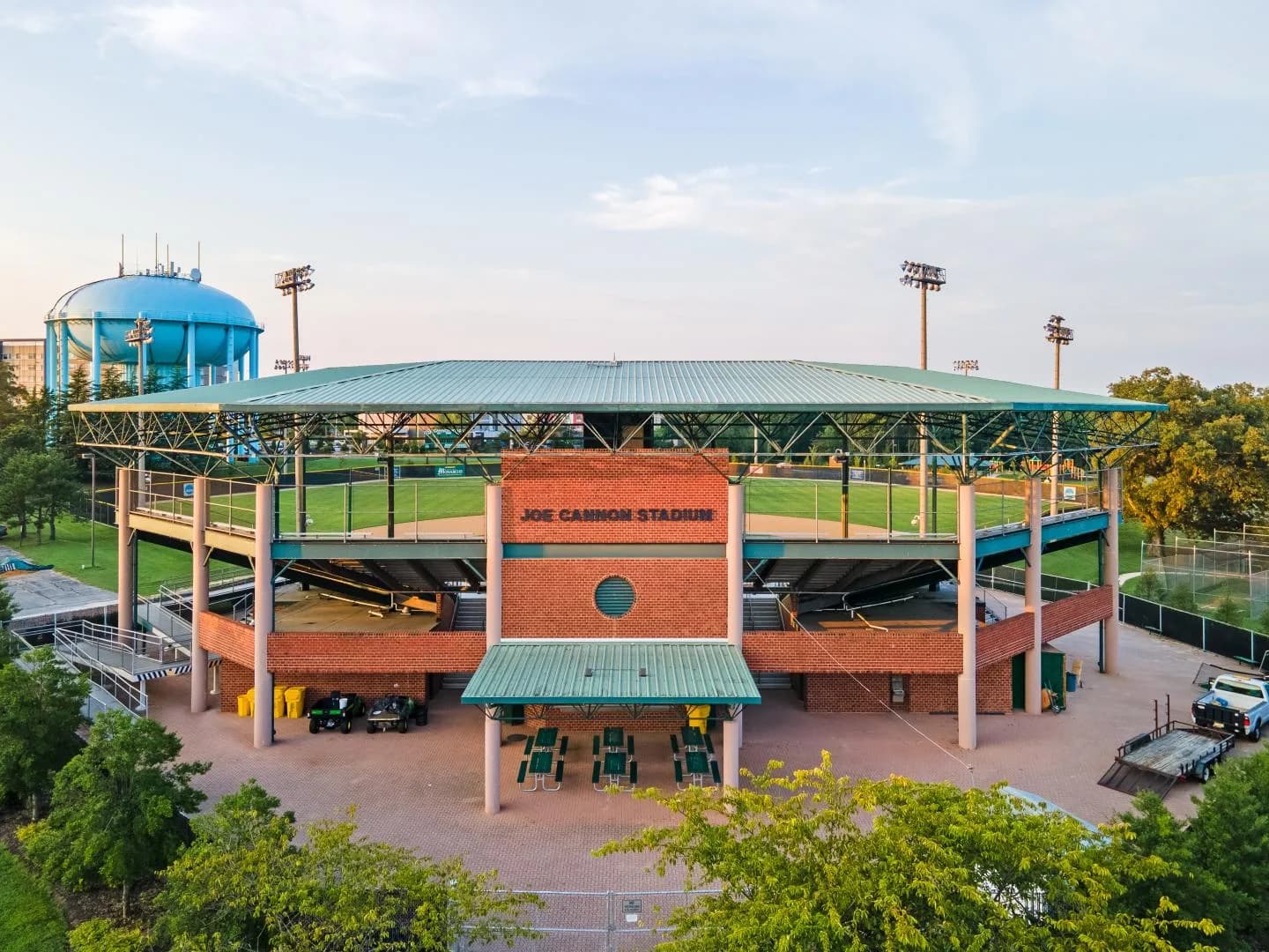 Joe Cannon Stadium’s signed brick entrance, covered roof and nearby water tower in Anne Arundel County’s official collection. This actual exterior view supplies no exact capture date or guarantee of the current accessible entrance route.