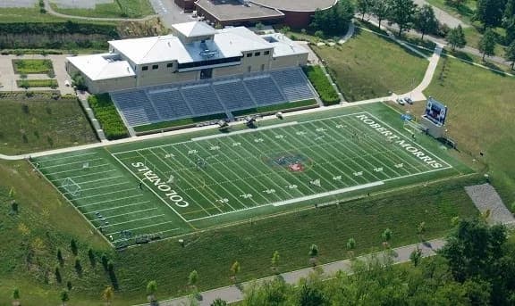 Joe Walton Stadium’s main grandstand, field and surrounding campus in an older university-published aerial photograph.