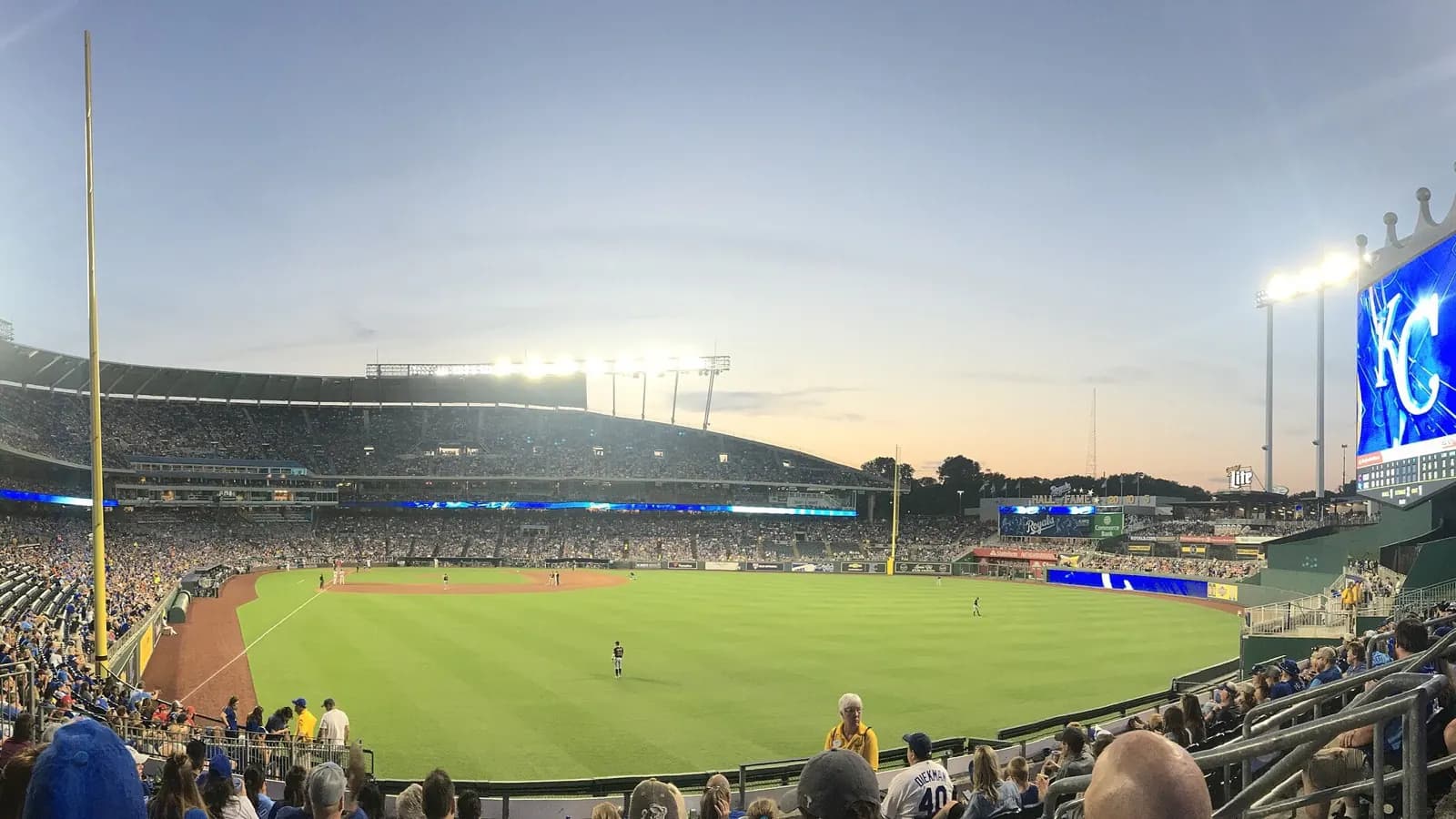 Wide panoramic view across Kauffman Stadium and its seating bowl.