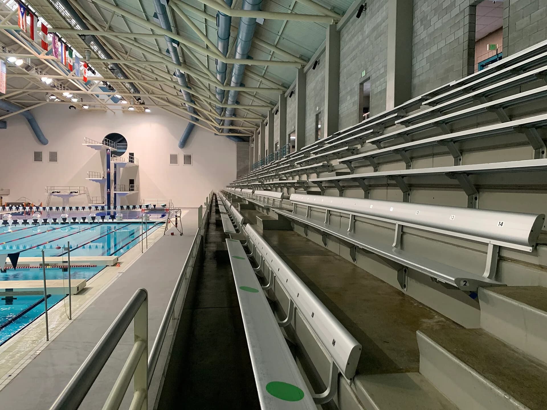 Bleacher seating beside the competition pool and diving well at Weyerhaeuser King County Aquatic Center.