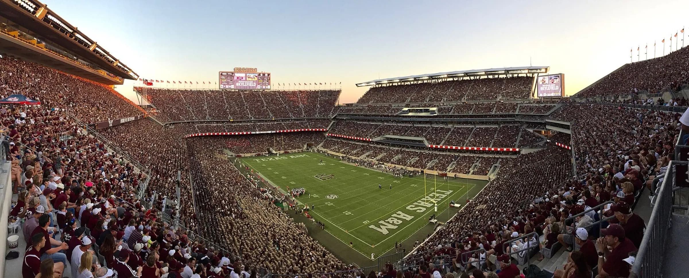 Expansive panorama across Kyle Field's football field and multi-tier seating bowl.