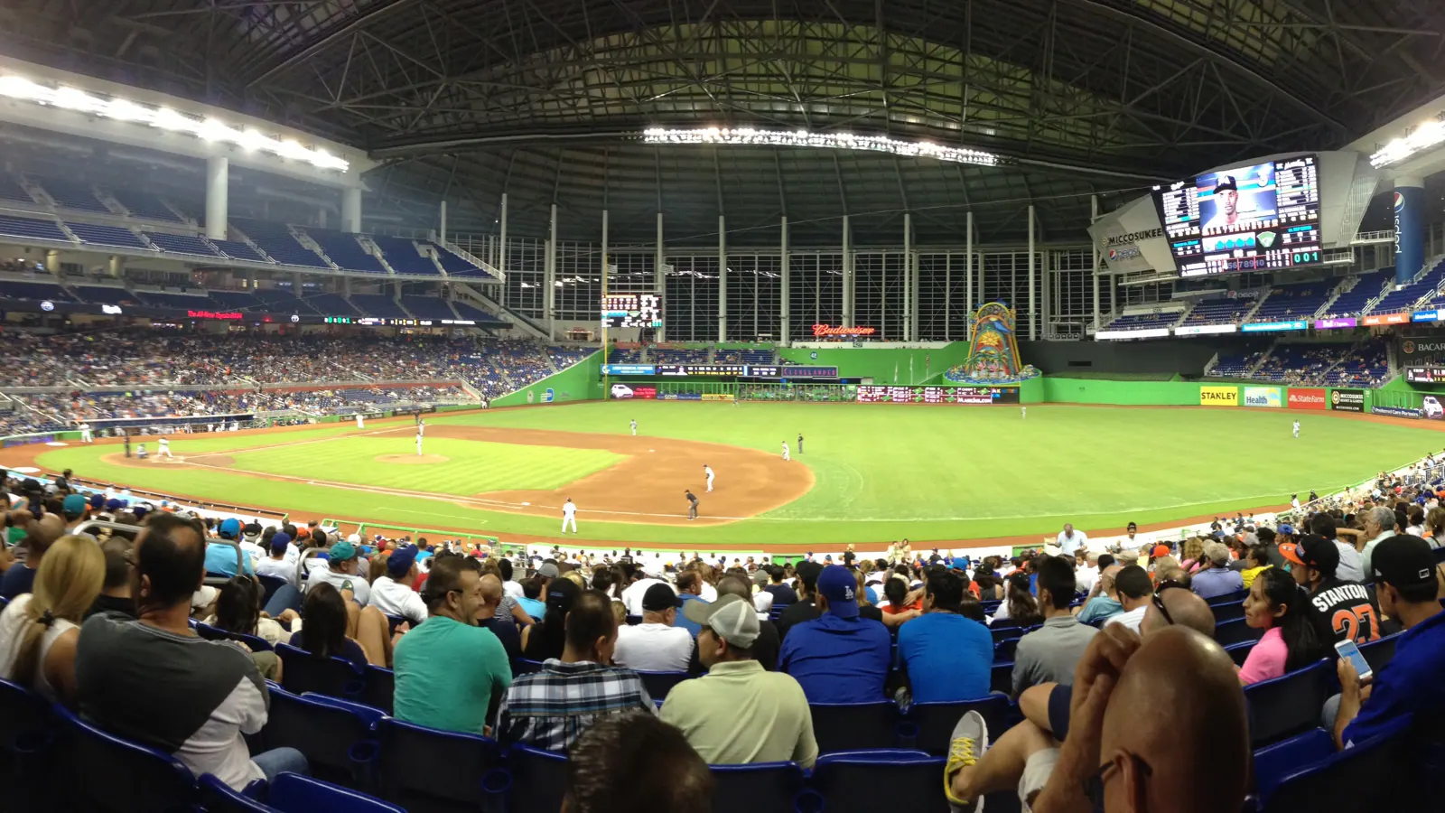 Panoramic game-day view across loanDepot park's field, retractable roof, and seating bowl.