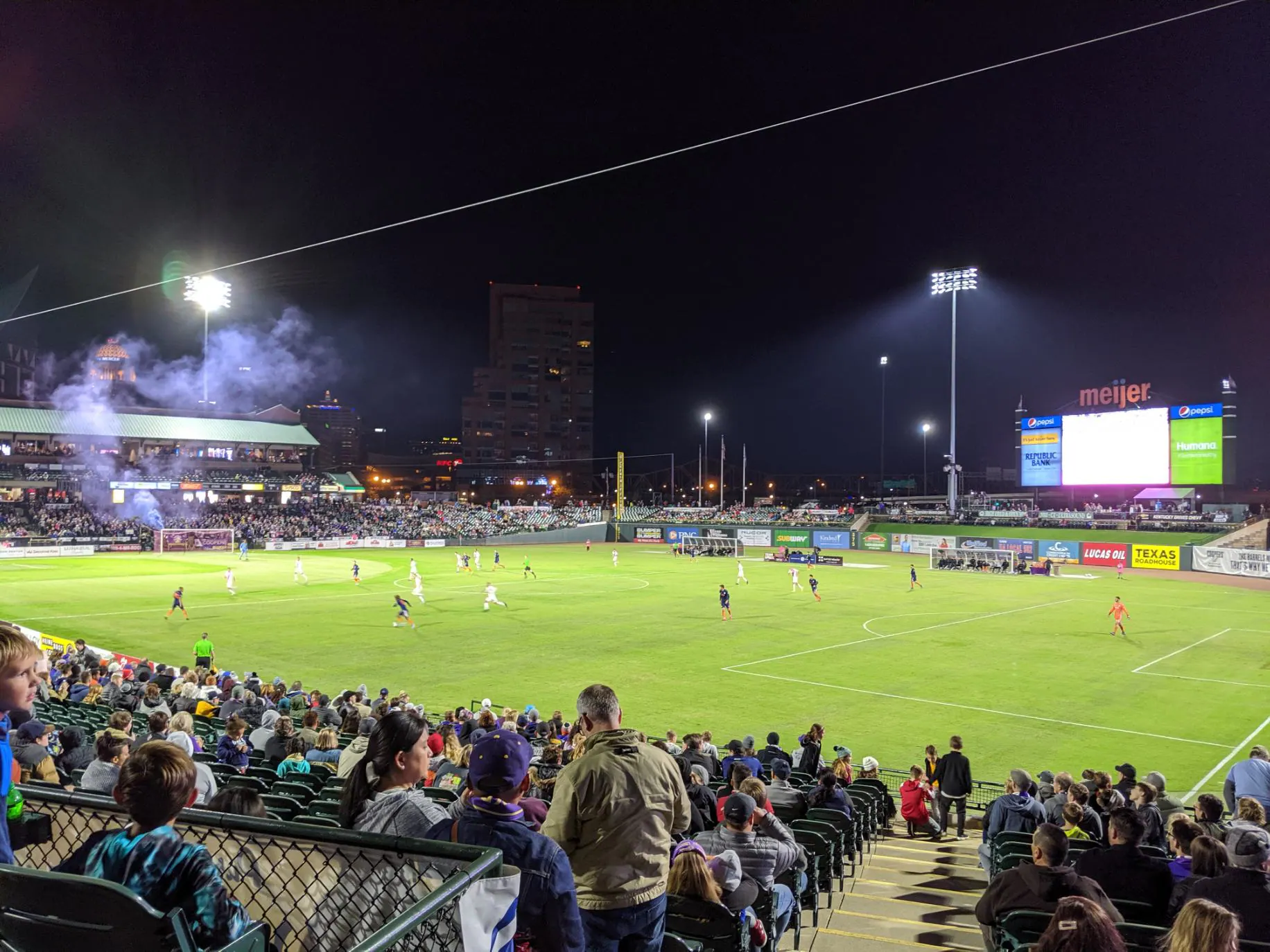 Night match view across the field and grandstands at Louisville Slugger Field