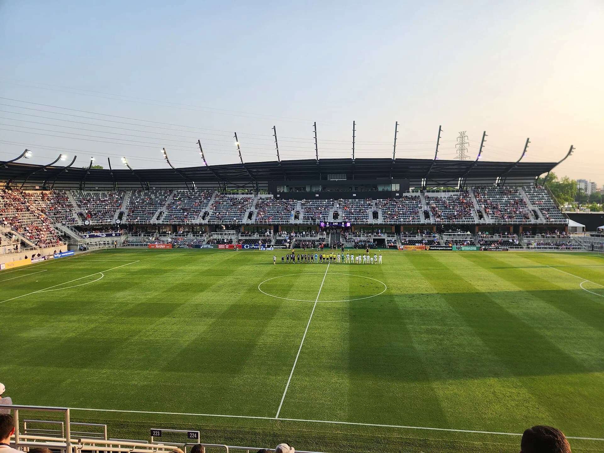 A wide view of Lynn Family Stadium's field and seating bowl during a soccer match.