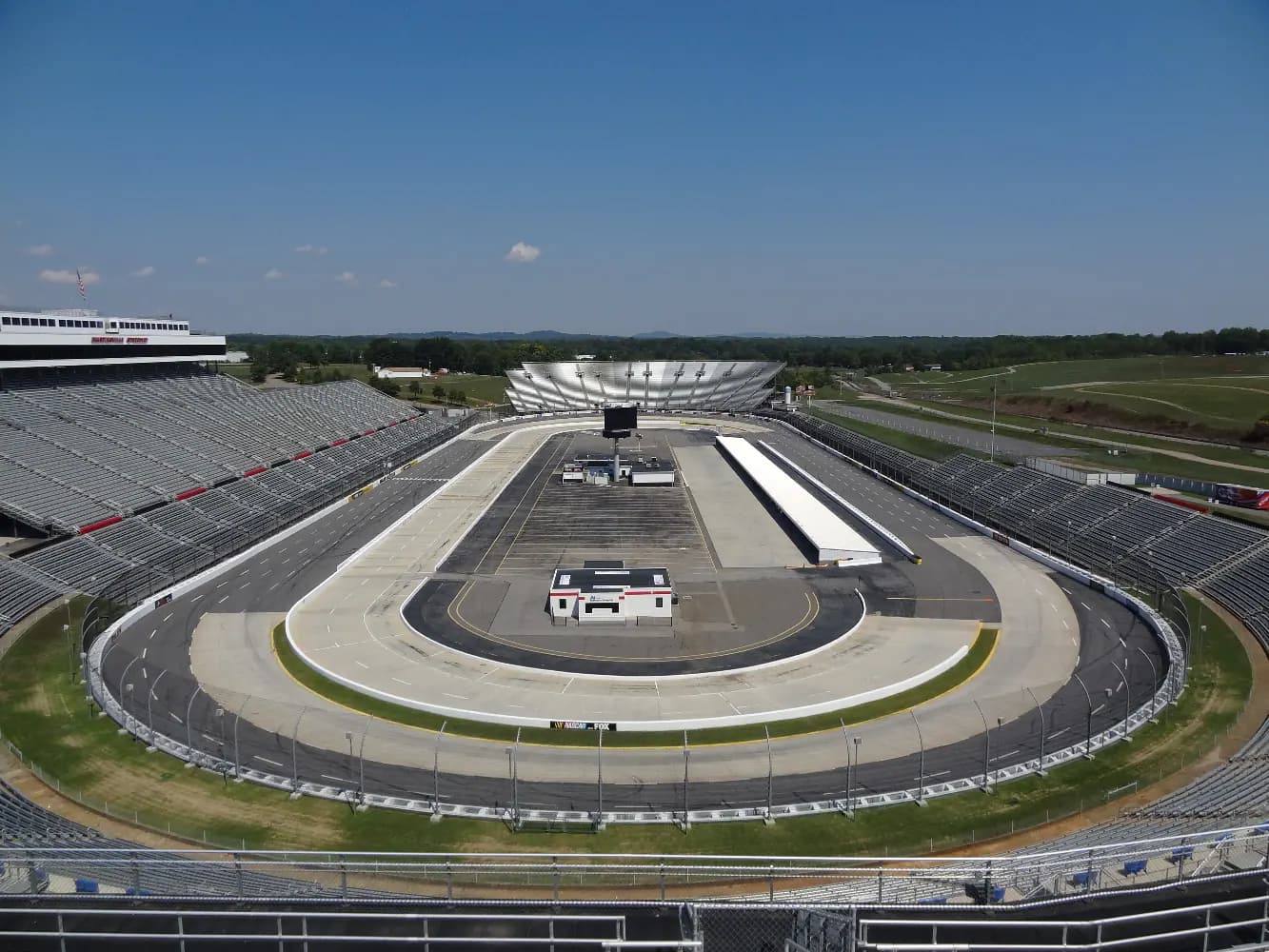 High wide view showing the full oval, pit road, and grandstands at Martinsville Speedway