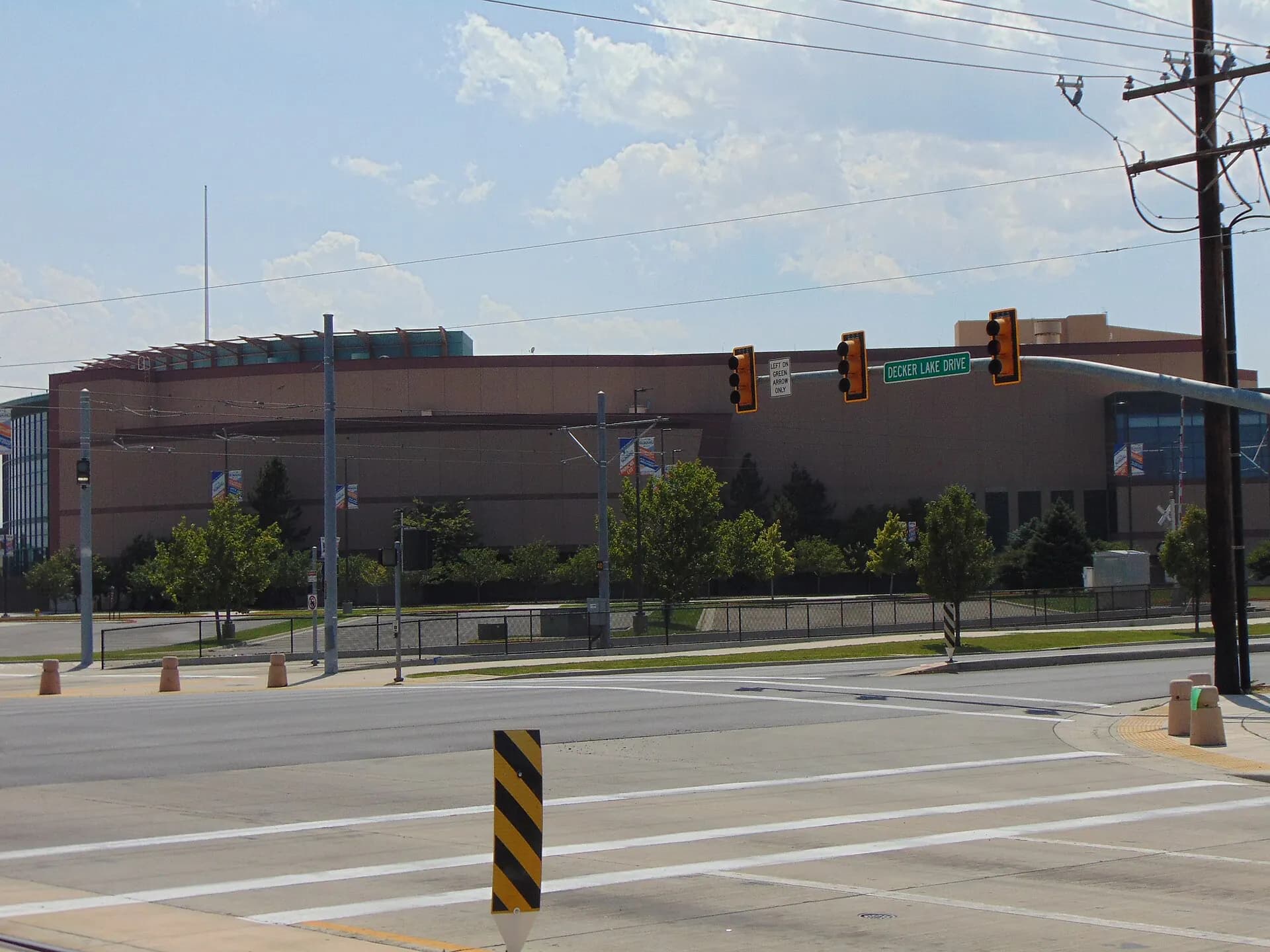 The Maverik Center exterior and entrance seen from Decker Lake TRAX station.