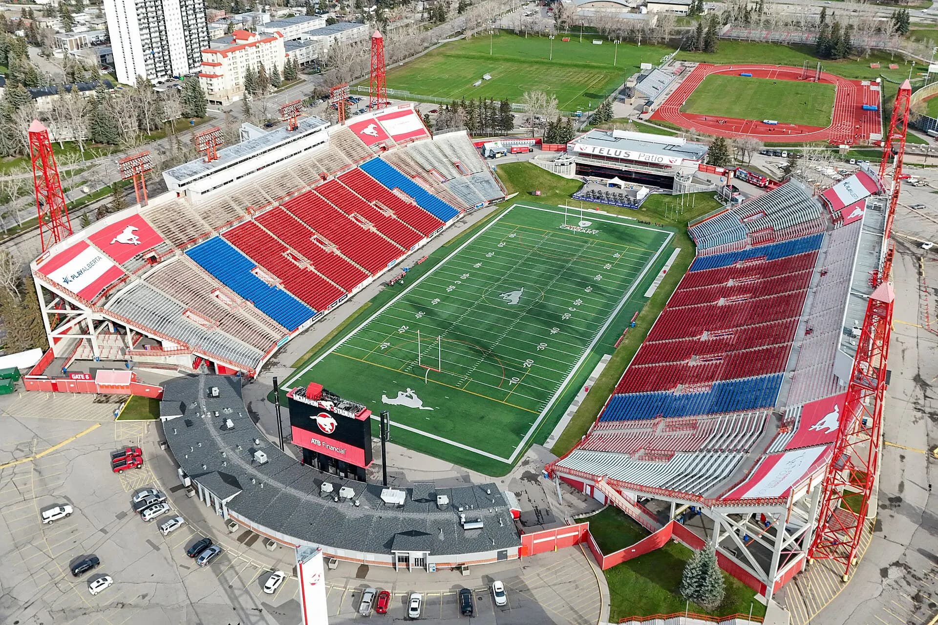Aerial establishing view of McMahon Stadium's field and seating in Calgary