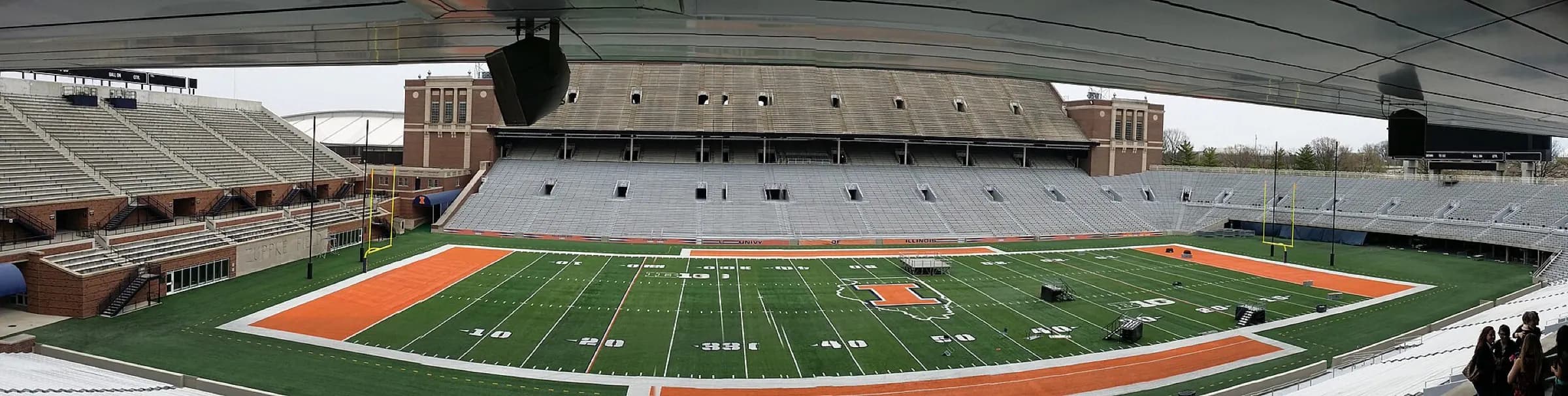 Ultra-wide interior panorama of the field and grandstands at Gies Memorial Stadium.