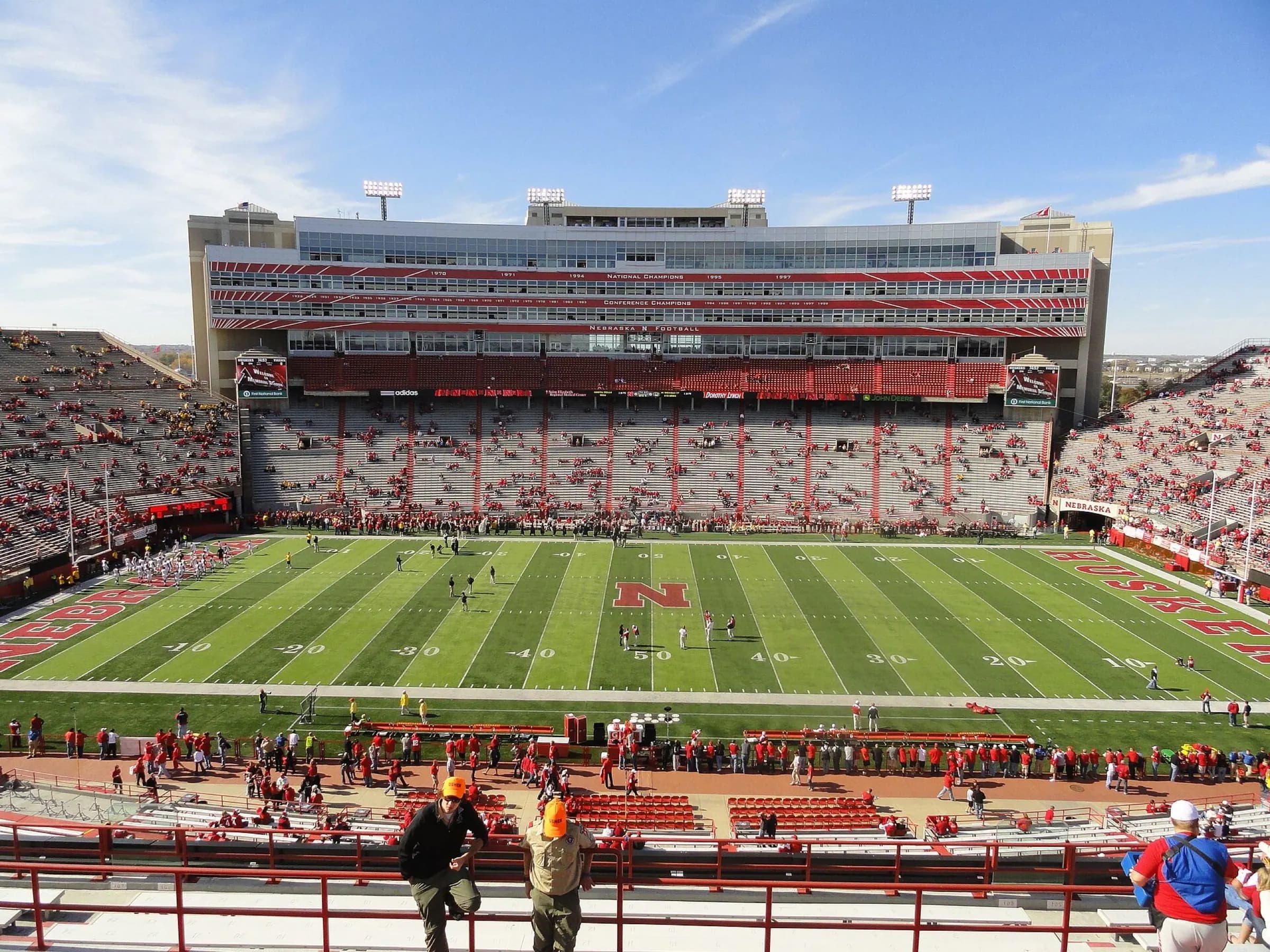 Field-level view across Memorial Stadium's turf and surrounding seating.