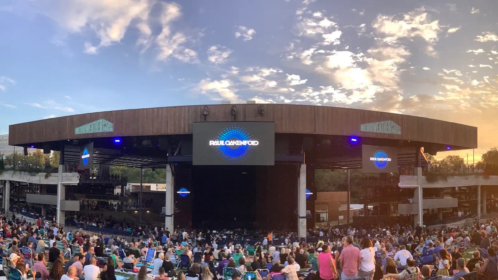 Wide panoramic view of Merriweather Post Pavilion and its audience lawn.