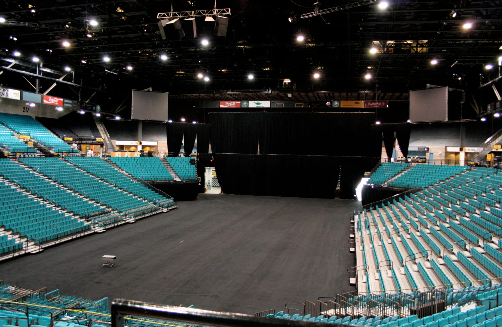 Wide interior view of the floor, stage setup, and seating bowl at MGM Grand Garden Arena.