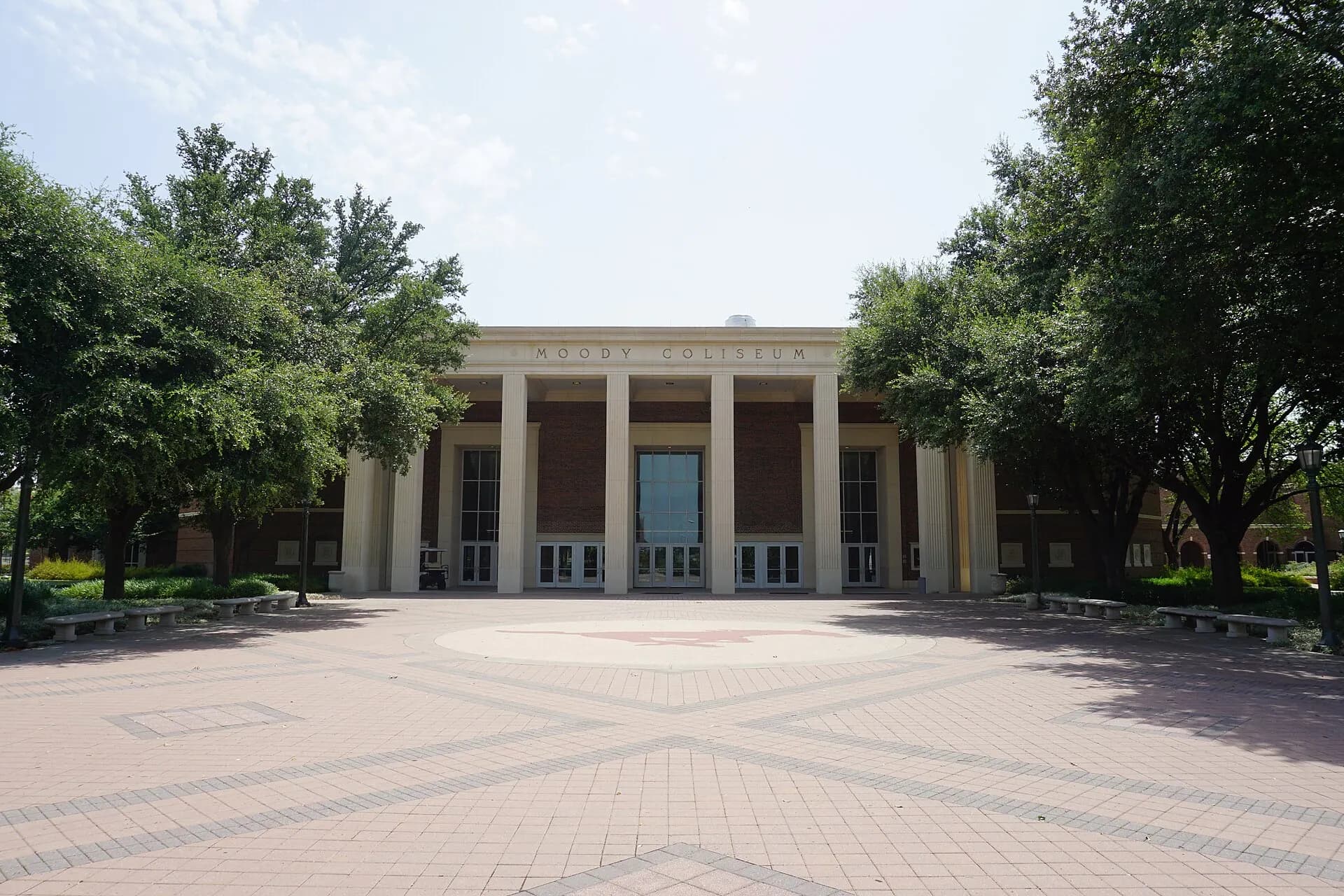 Moody Coliseum's brick facade and main entrance on the SMU campus.