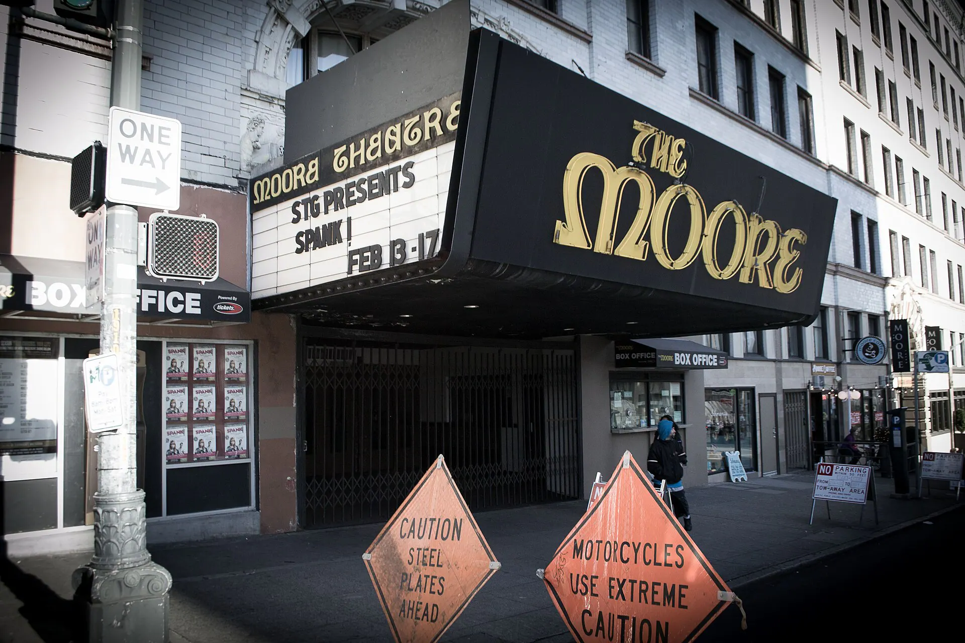 Wide exterior view of the Moore Theatre facade and marquee in downtown Seattle.