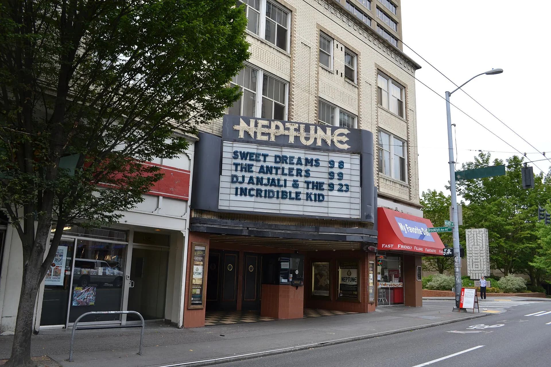 Street-level view of the Neptune Theatre marquee and entrance in Seattle.