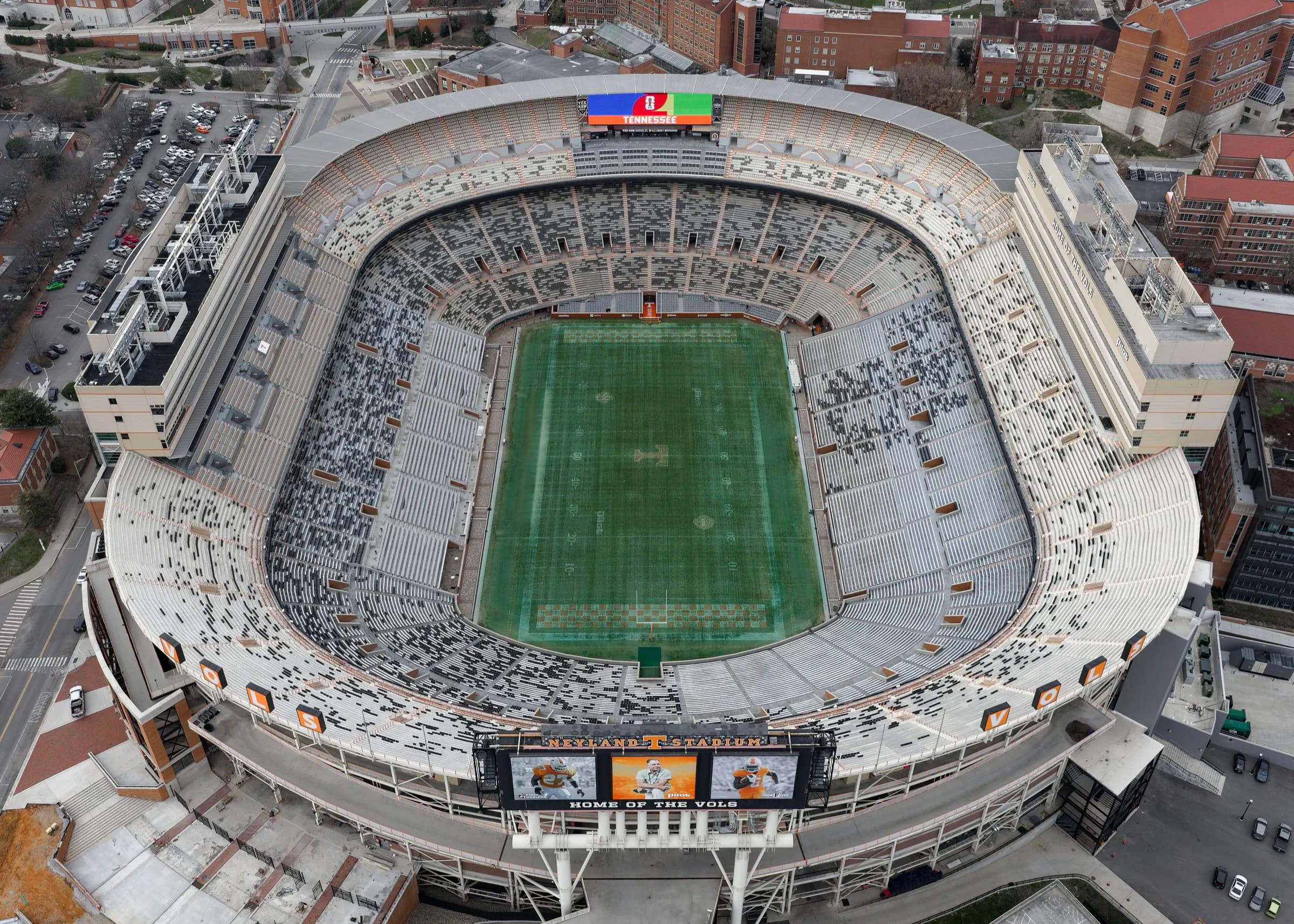 Current high-resolution aerial showing Neyland Stadium's complete field, seating bowl, rooflines, and riverfront setting.